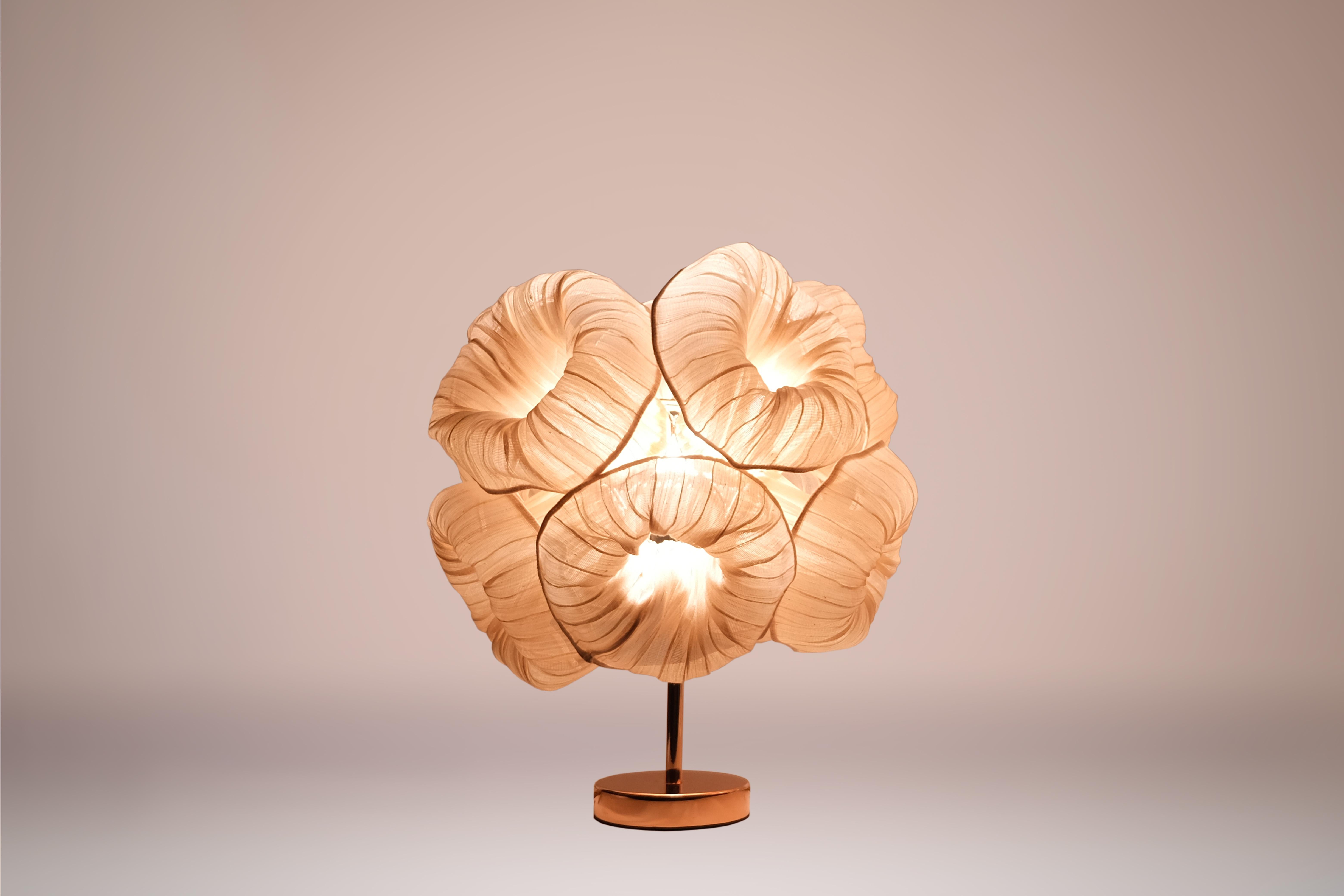 The Anemone Table Lamp is named for the soft, brightly colored sea creatures that look like a flower and often live on rocks under water. A little mermaid’s best friend, the Anemone Lamp is inspired by sea corals to brighten up your life. 

This