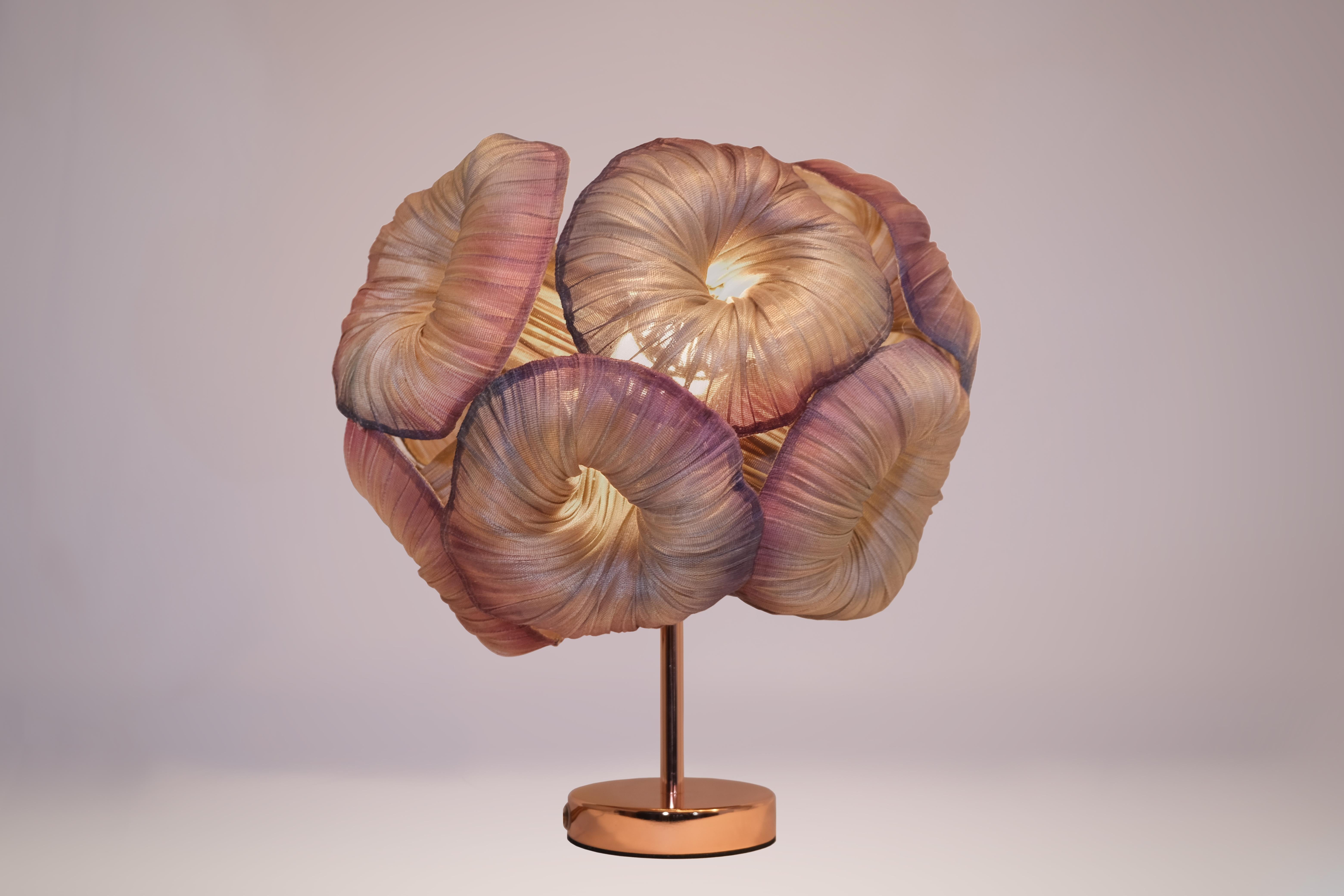 The Anemone table lamp. Named for the soft, brightly colored sea creatures that look like a flower and often live on rocks under water. A little mermaid’s best friend, the Anemone Lamp is inspired by sea corals to brighten up your life. 

This piece
