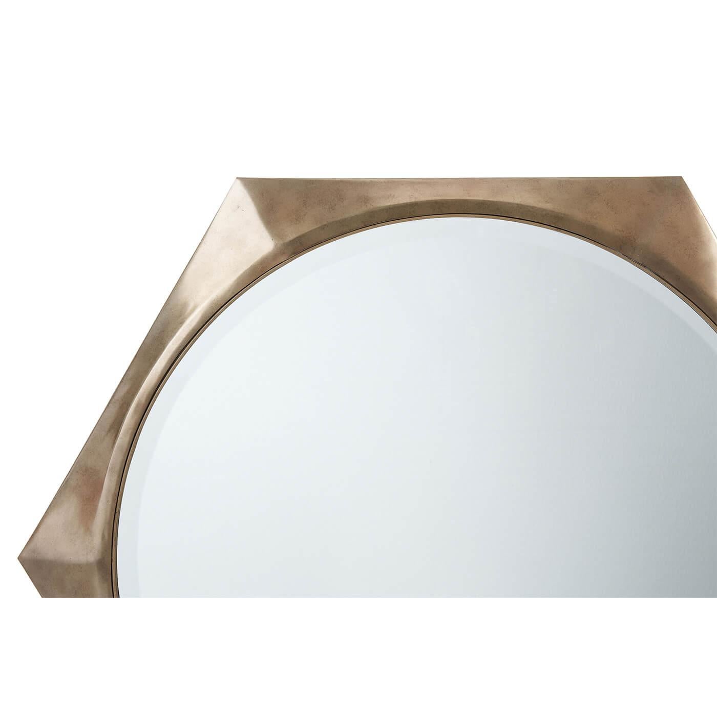 A modern hexagonal mirror is a modern solitaire frame inspired by a watch face. A round bevel-edge mirror plate is cast in a faceted octagonal frame. An understated yet striking decorative wall mirror in a vintage Brass finish.

Dimensions: 36
