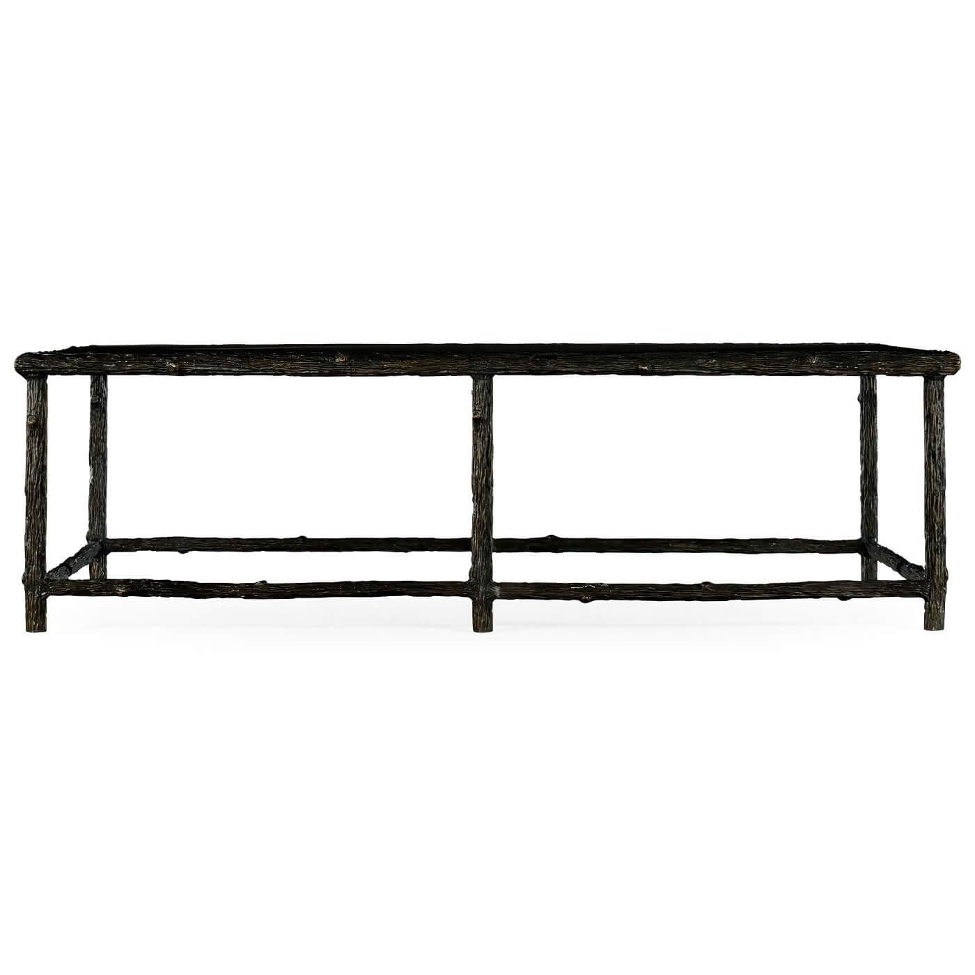 A modern faux bois coffee table with an antiqued bronze finish. The natural look of modern branches with a glass top and stretcher base.

Dimensions: 60