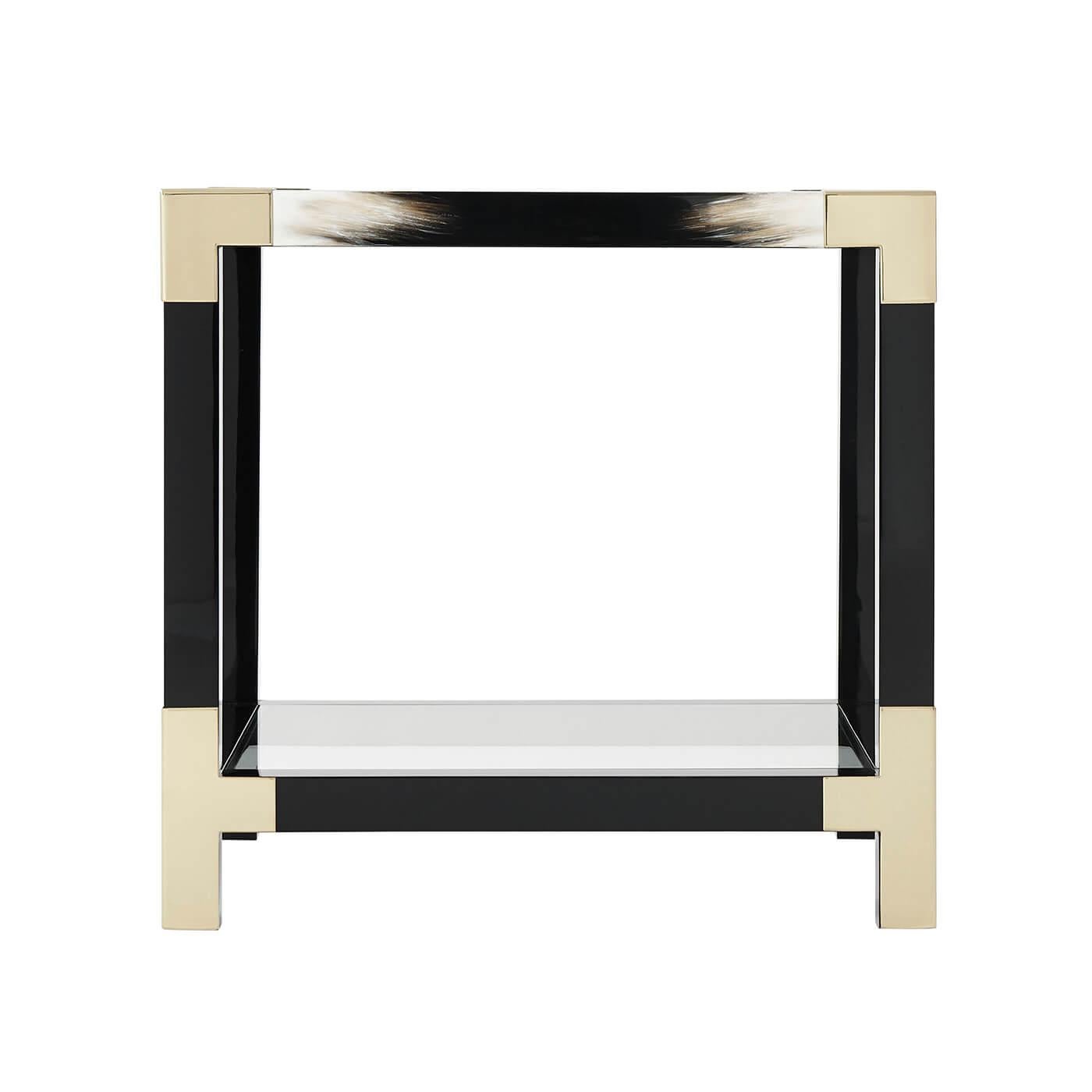 A black lacquered and faux horn painted accent table, the square glass inset top with brass edged corners, on square legs joined by stretchers and an inset glass undertier.

Dimensions: 25