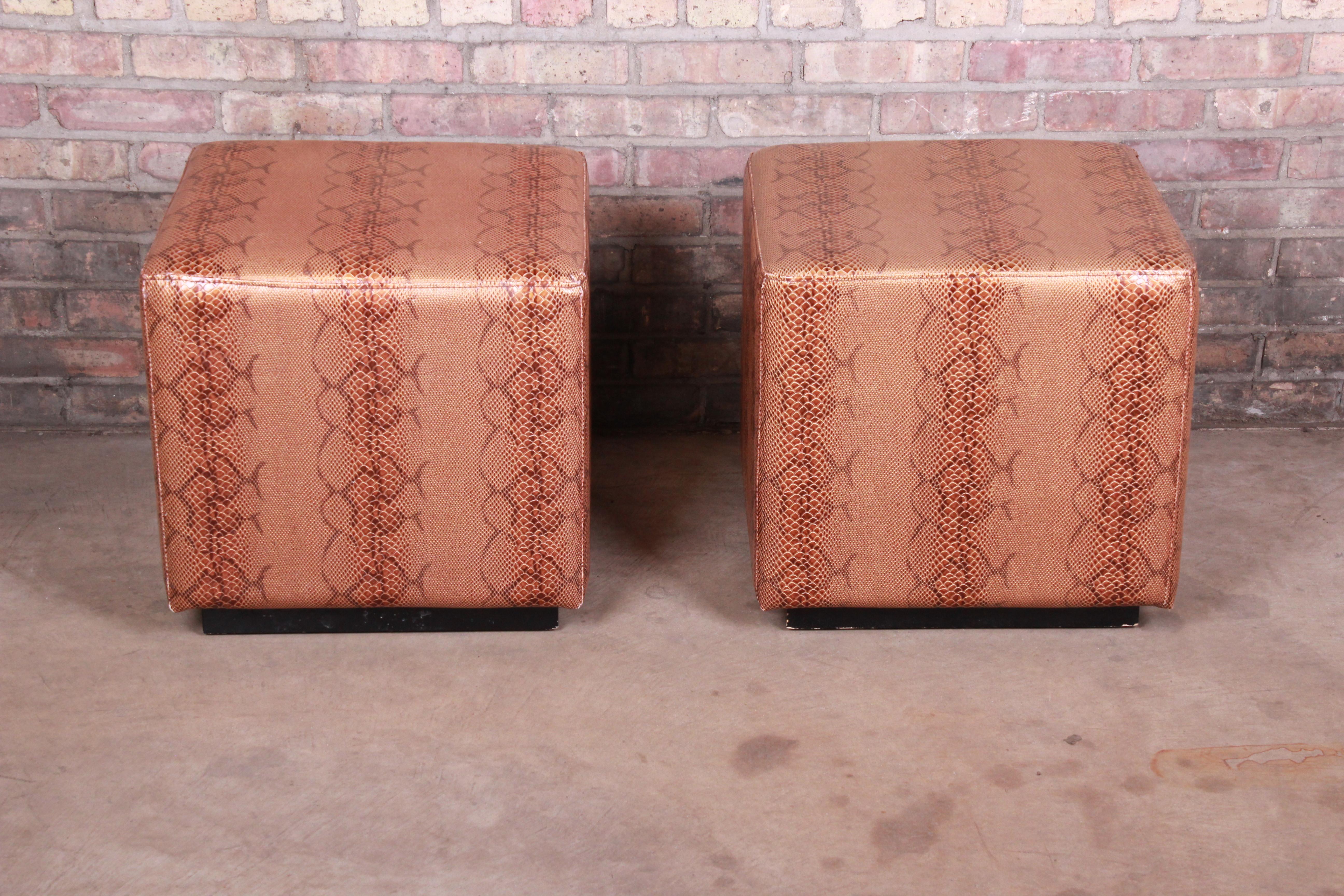 A gorgeous pair of modern faux snake skin cube ottomans or footstools,

circa 1990s

Measures: 19