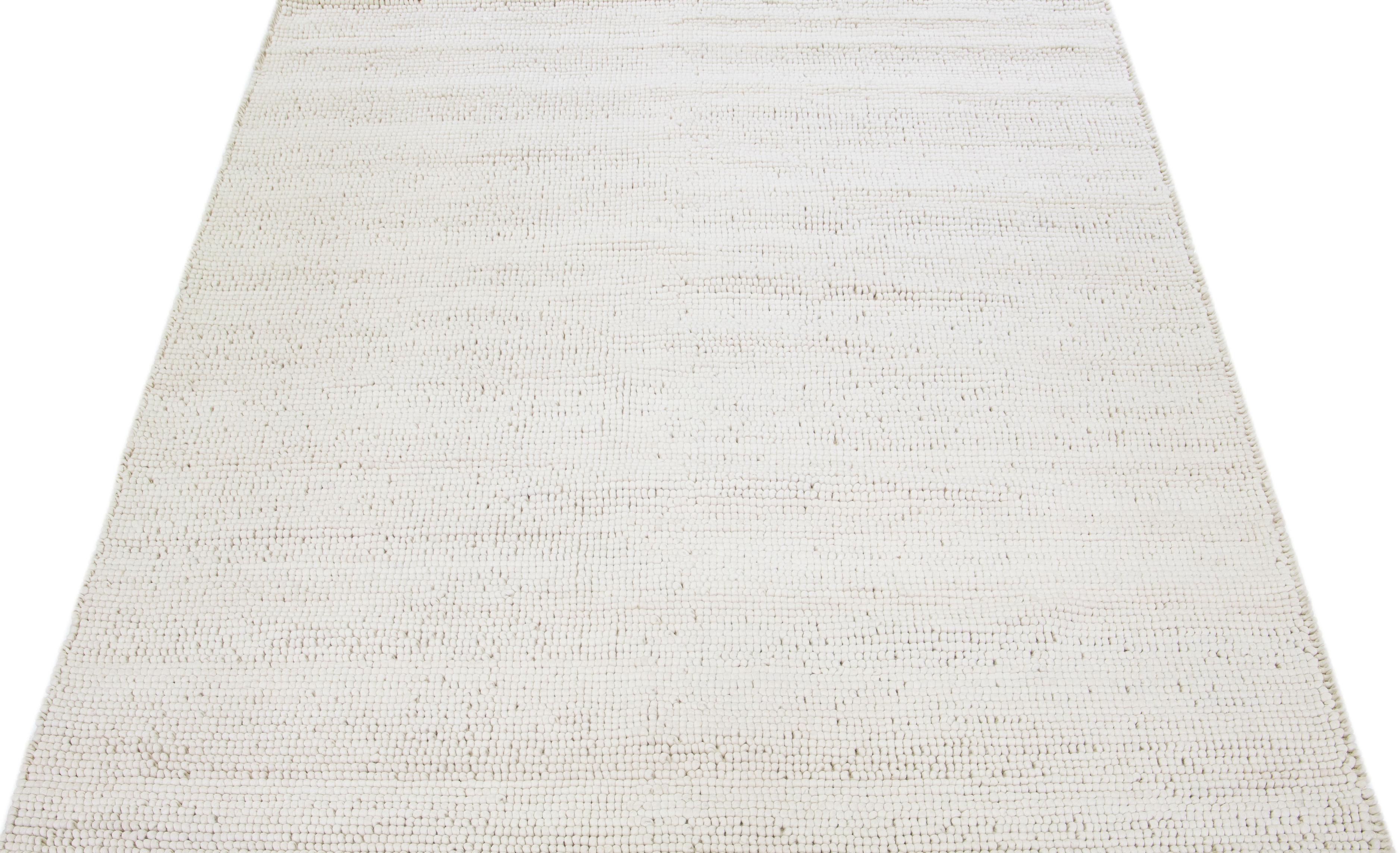 This beautiful Felt hand-woven wool rug is part of our Westport Collection with an Ivory color field and features an all-over geometric design.

This rug measures: 9' x 12'.

Custom colors and sizes are available upon request.

 