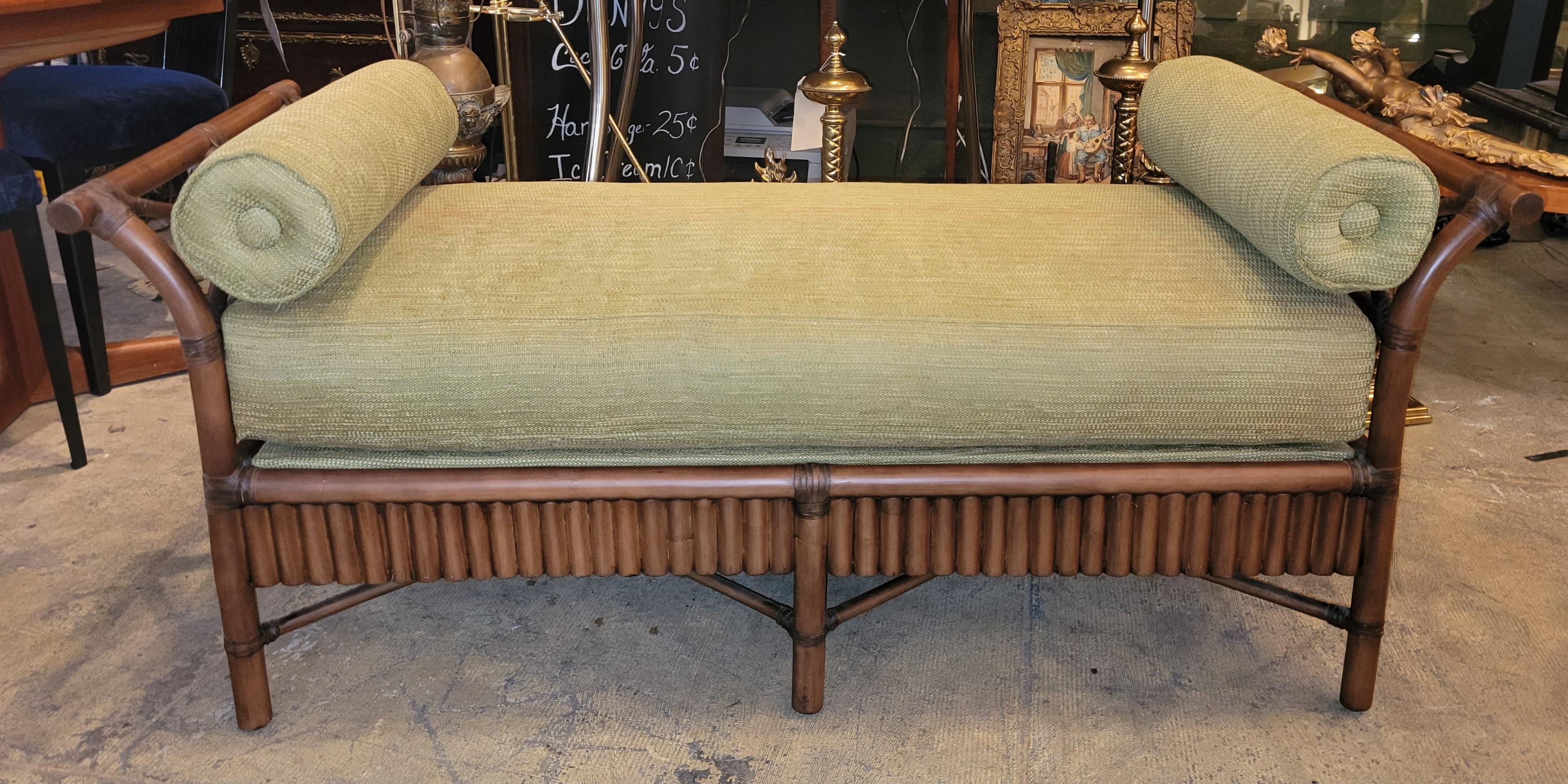 Wonderful day bed with bamboo structure and rattan webbing. 
The cushion is custom made for this daybed and fits snug into the frame. 
There are 2 cylindrical kidney pillows that go with this daybed made in matching fabric.