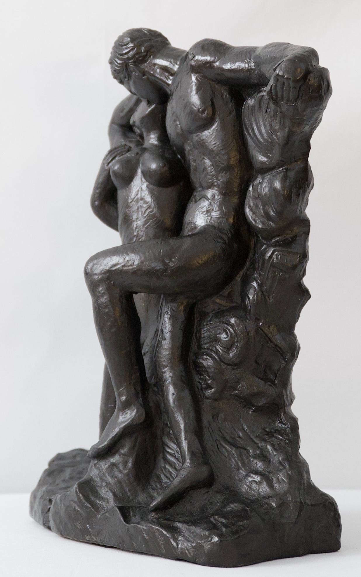 An eye-catching figurative sculpture of a kissing couple in the style of Henry Moore. 

This piece is made from hand-cast and hand-finished Durastone, which is a special formulation of crushed stone mixed with slurry. It has a beautiful