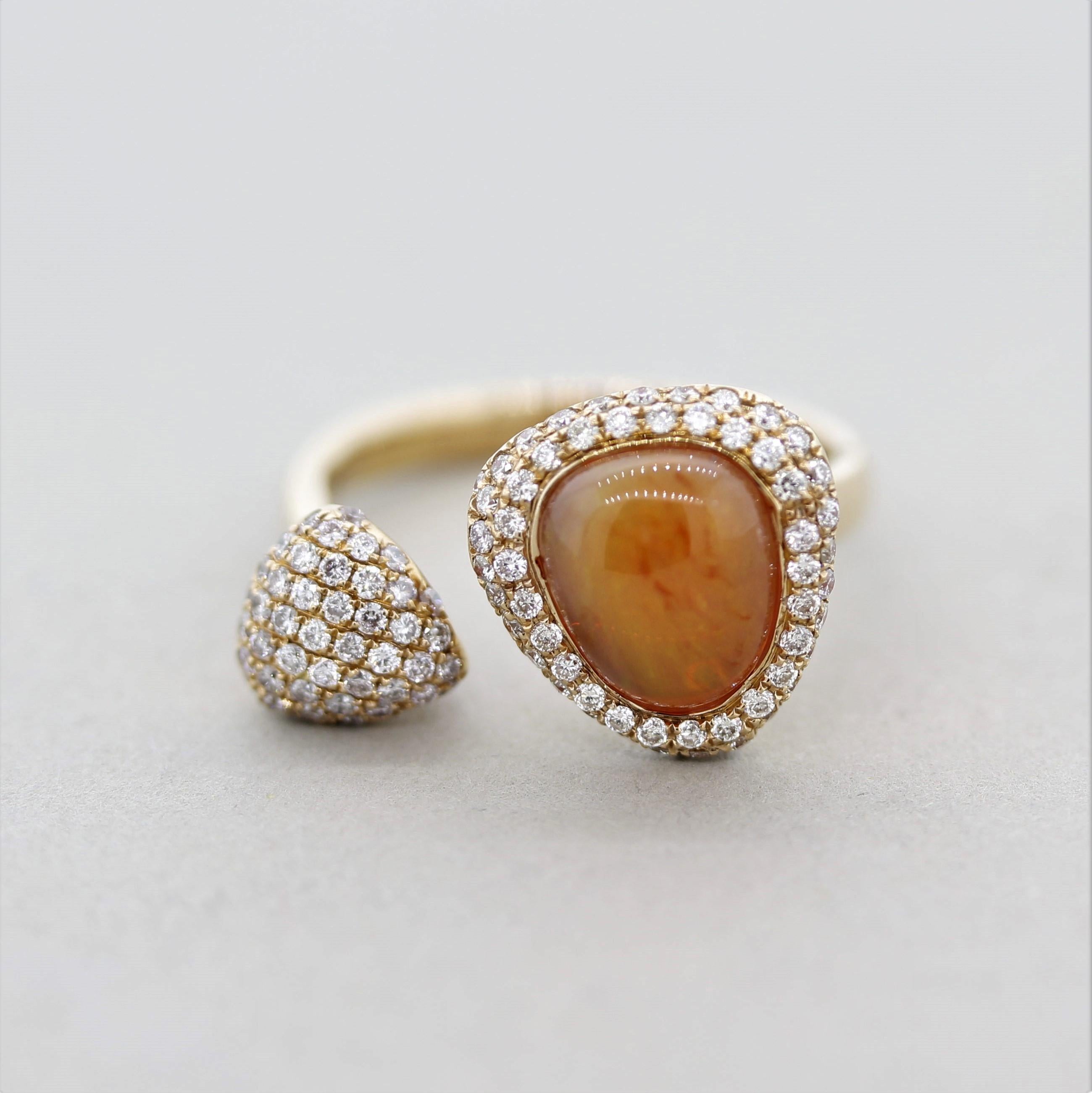 A stylish ring featuring an orange Mexican fire opal weighing 2.52 carats. It is accented by 0.58 carats of round brilliant-cut diamonds which surround the opal as well as the other “twin.” Made in 18k rose gold and ready to be loved!

Ring Size 6.75