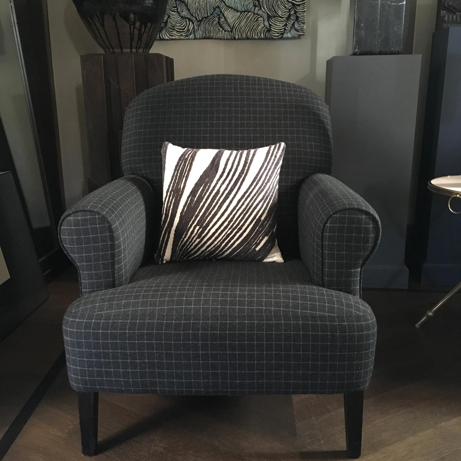 This modern armchair is presented in a wool grey checkered fabric. The result is an elegant presence to complete little and cosy spaces, in the living room or bedroom, where to read or have relax listening music.
Piece of Flamant Home