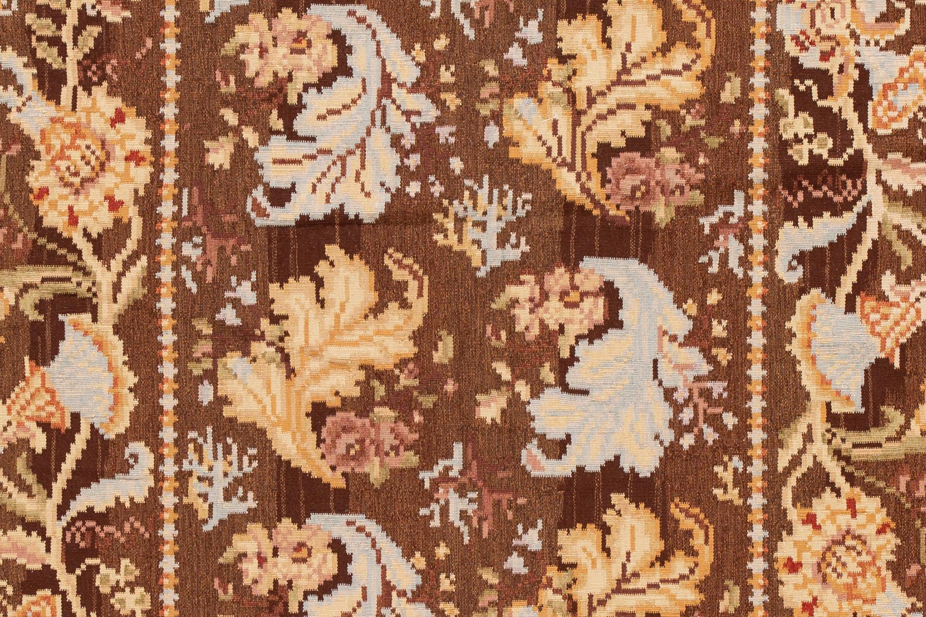 Modern flat-weave Kilim rug with an all-over floral design. This piece has fine details, great colors, and a beautiful design. It would be the perfect addition to your home. This rug measures 4'11