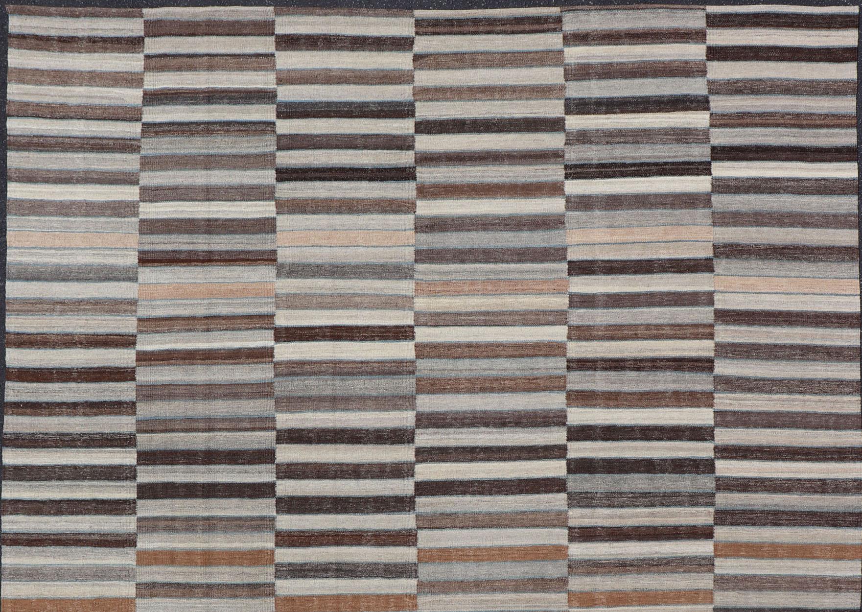 Modern flat-weave Kilim rug with stripes in shades of taupe, charcoal, gray and cream, Keivan Woven Arts / rug AFG-119, country of origin / type: Afghanistan / Kilim

This flat-woven kilim rug features a Classic stripe design that places