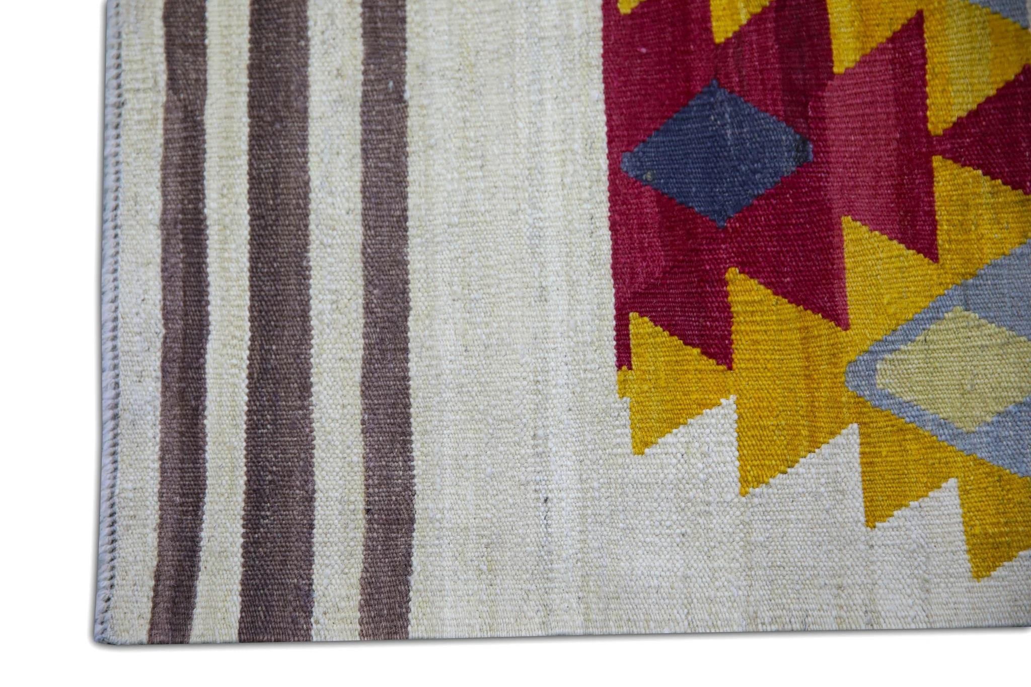 This exquisite Turkish flatweave Kilim rug is a stunning masterpiece of traditional craftsmanship. Each rug is meticulously handwoven by skilled artisans using age-old techniques that have been passed down through generations. The intricate design