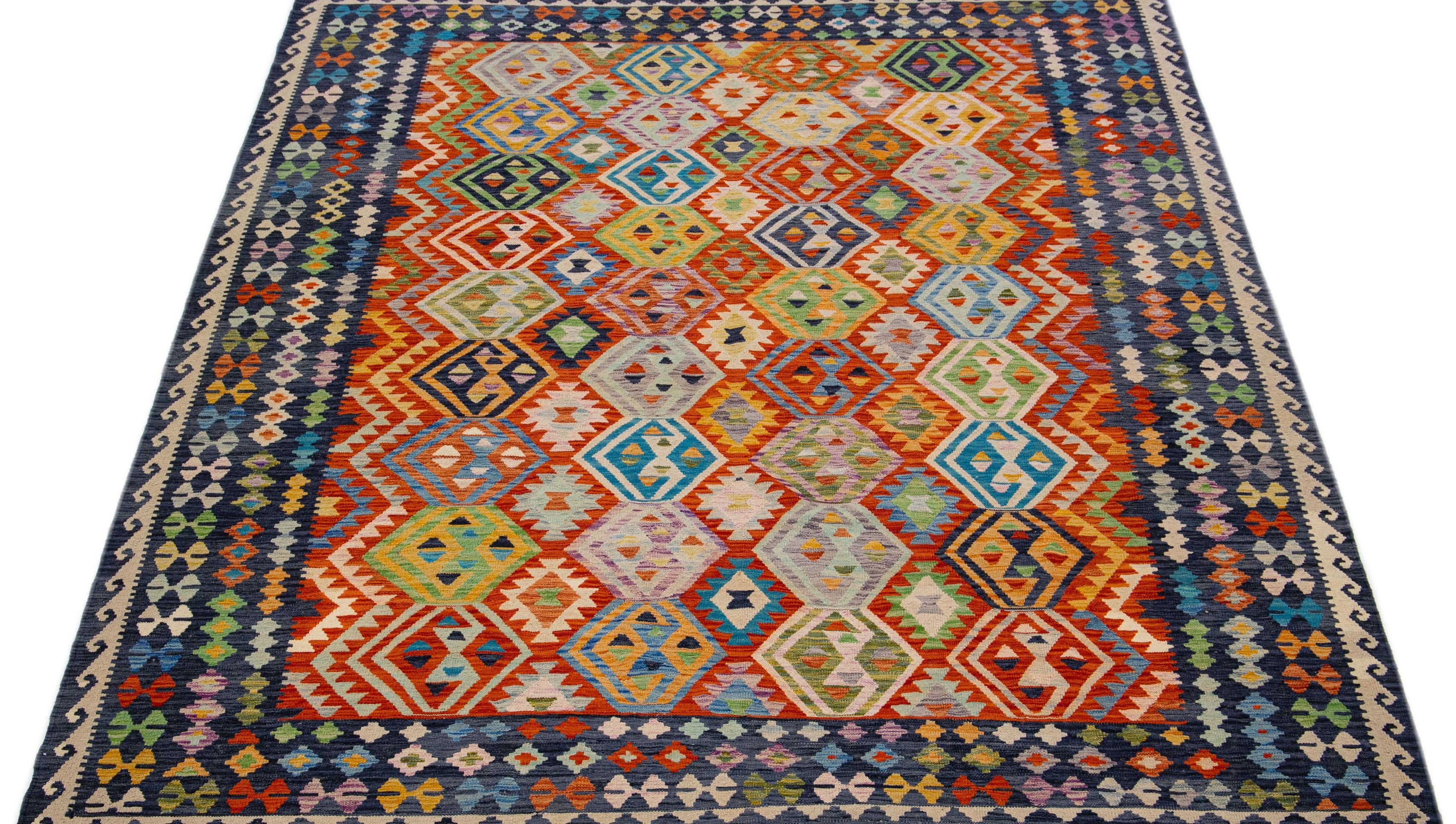 A contemporary kilim rug showcases an exuberant and detailed geometric motif throughout, employing a variety of multicolored tones that make it an ageless incorporation in modern interior design.

This rug measures 8'5