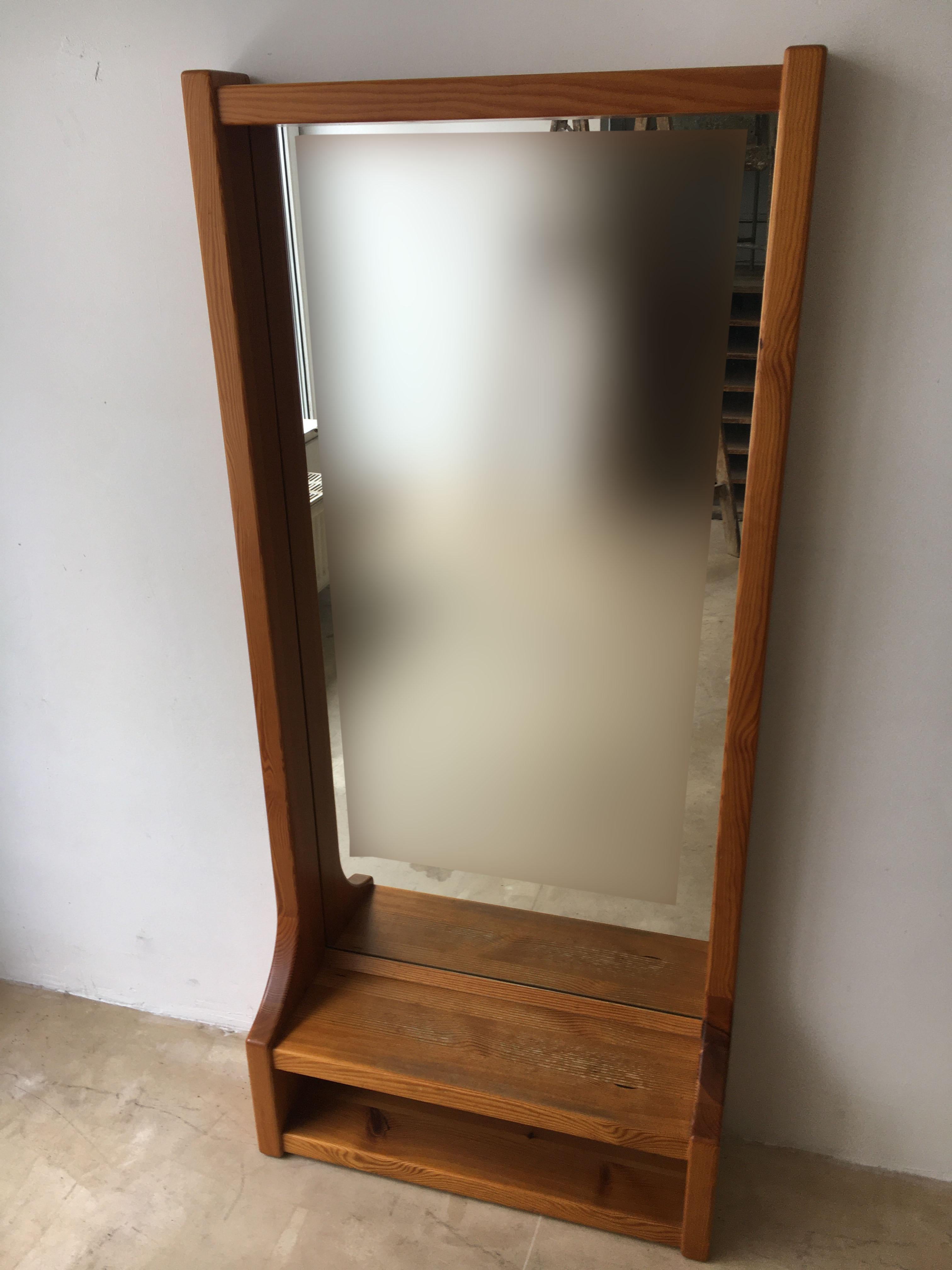 large mirror with floating shelf