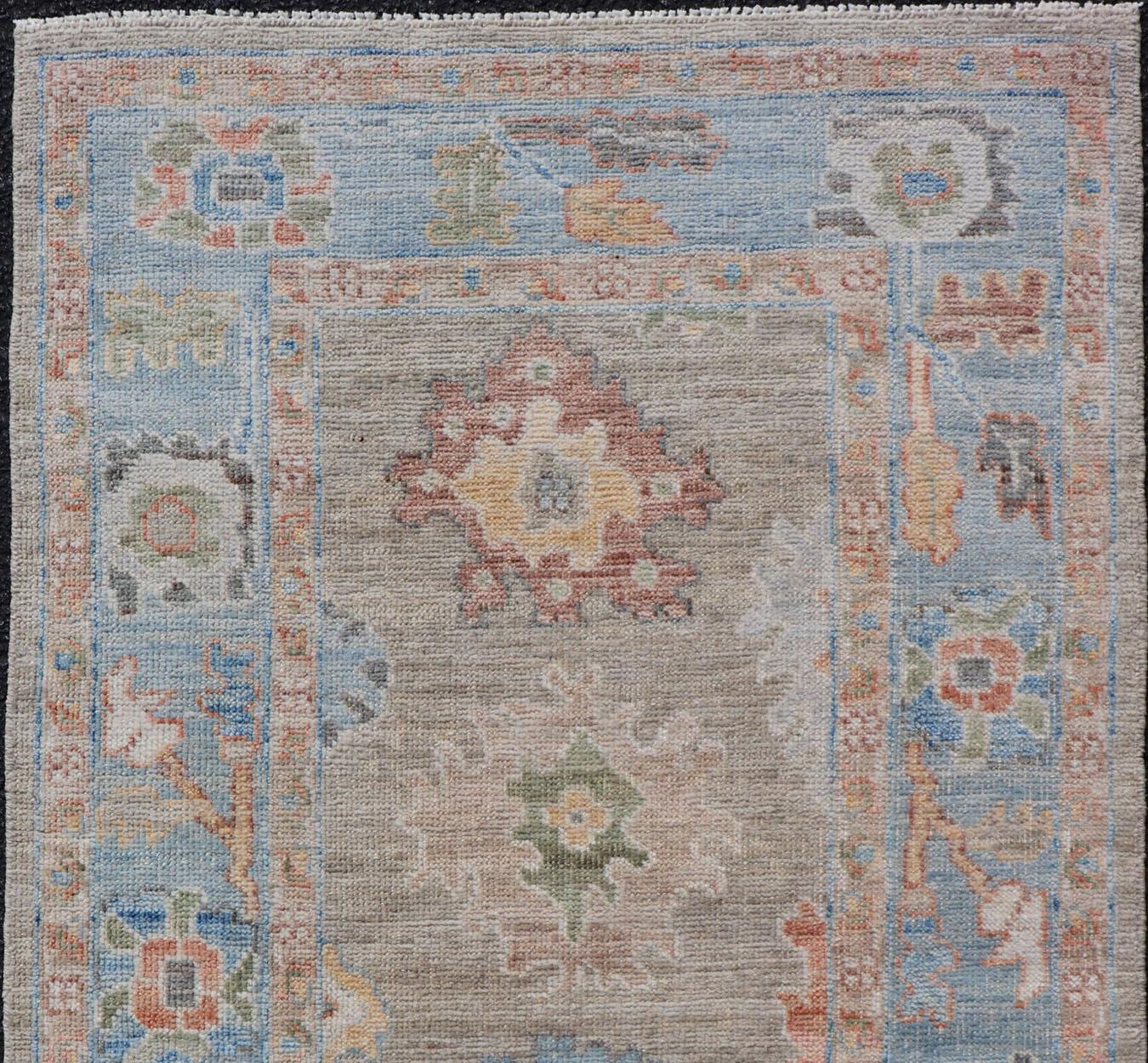 Afghan Modern Floral Oushak With Sandy-Brown Background and A Sky Blue Border For Sale