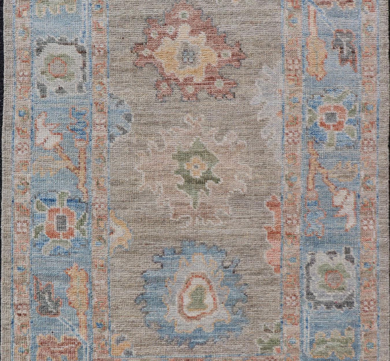 Hand-Knotted Modern Floral Oushak With Sandy-Brown Background and A Sky Blue Border For Sale