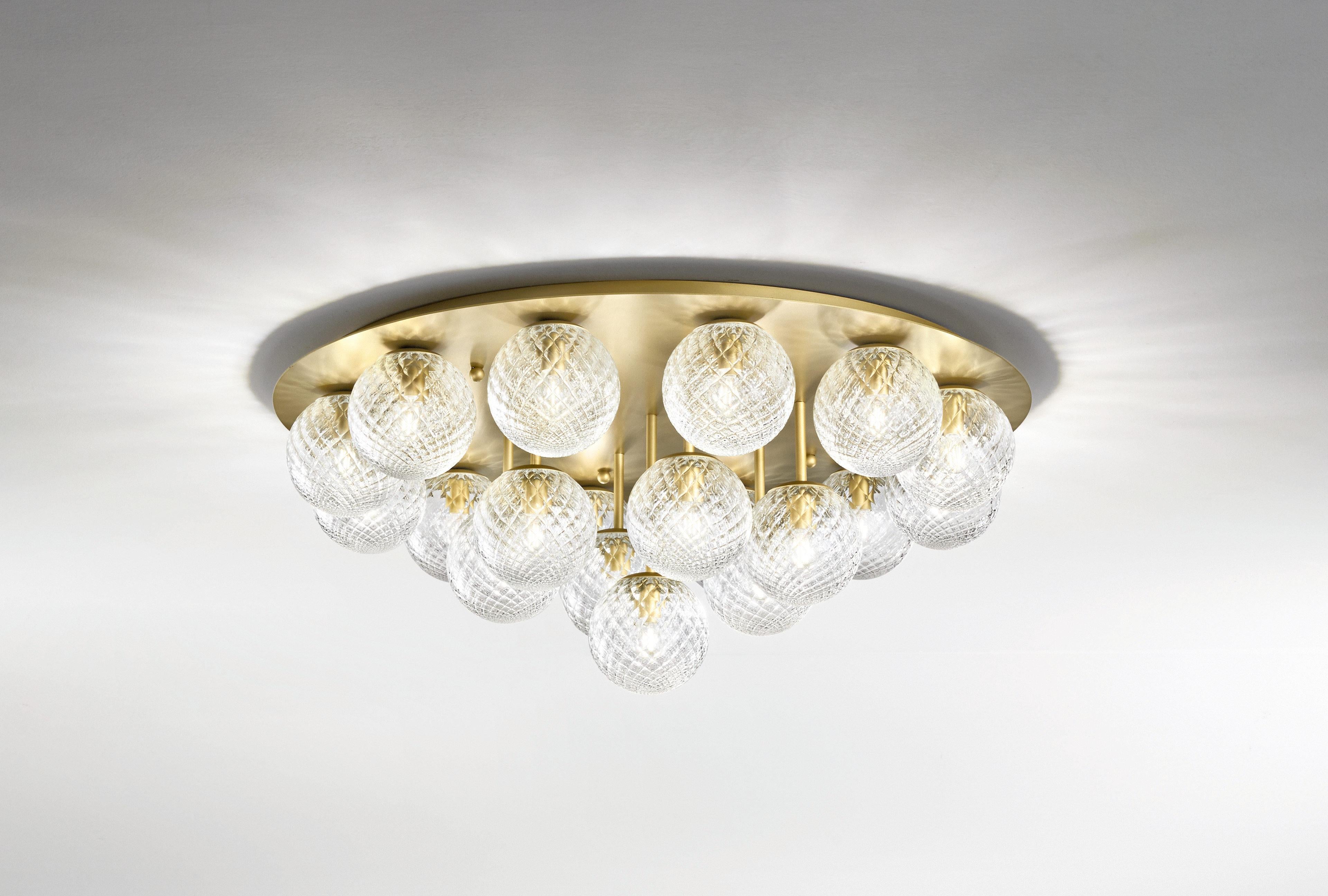 Italian modern flush mount with clear or smoky textured Murano glass globes, mounted on round ceiling plate in satin gold metal finish / Made in Italy by Fabio Ltd
19 lights / E12 or E14 type / max 40W each
Measures: diameter 37 inches, height 16