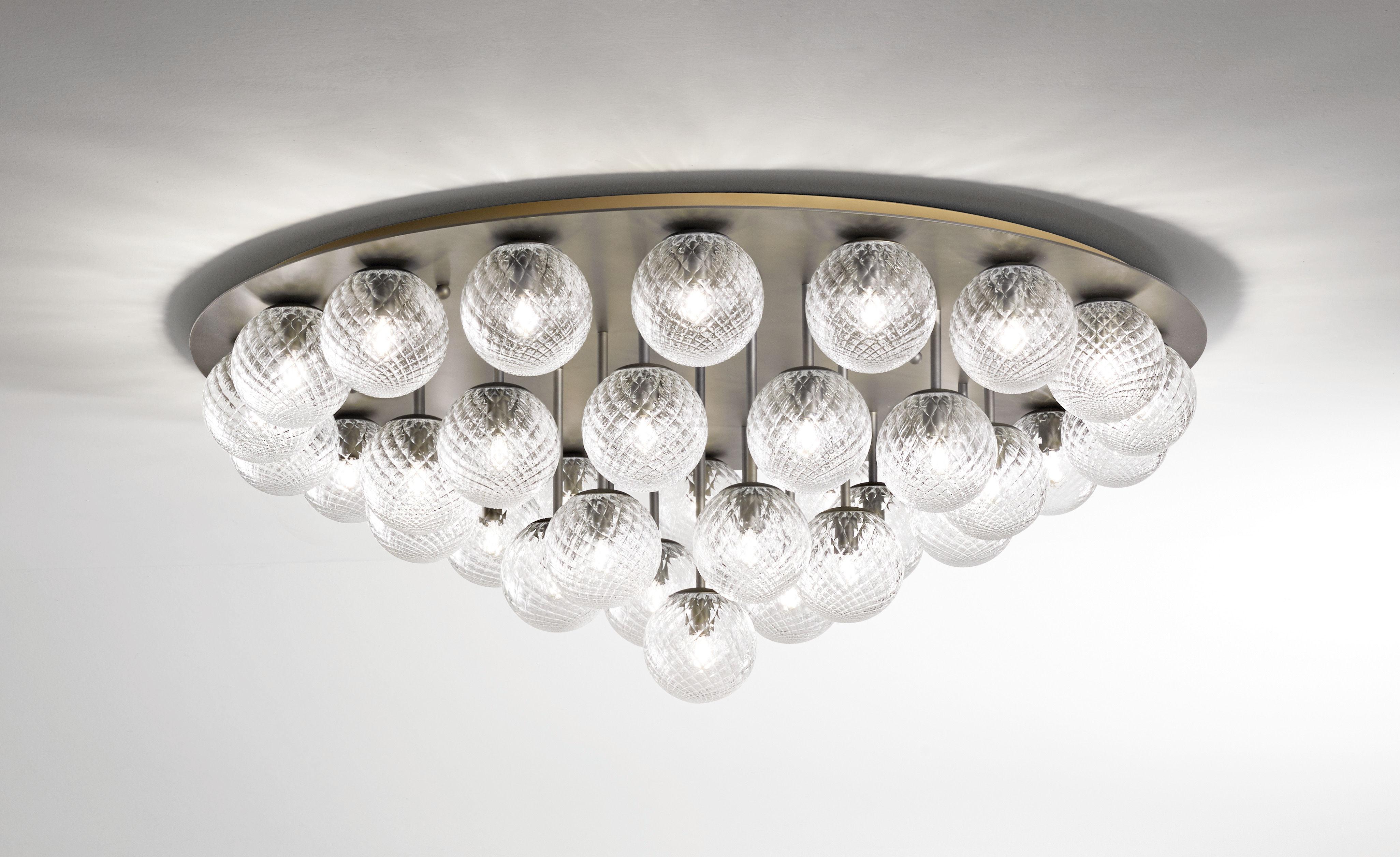 Italian modern flush mount with clear or smoky textured Murano glass globes, mounted on round ceiling plate in satin bronzato finish / Made in Italy by Fabio Ltd
37 lights / E12 or E14 type / max 40W each
Measures: diameter 52 inches, height 20
