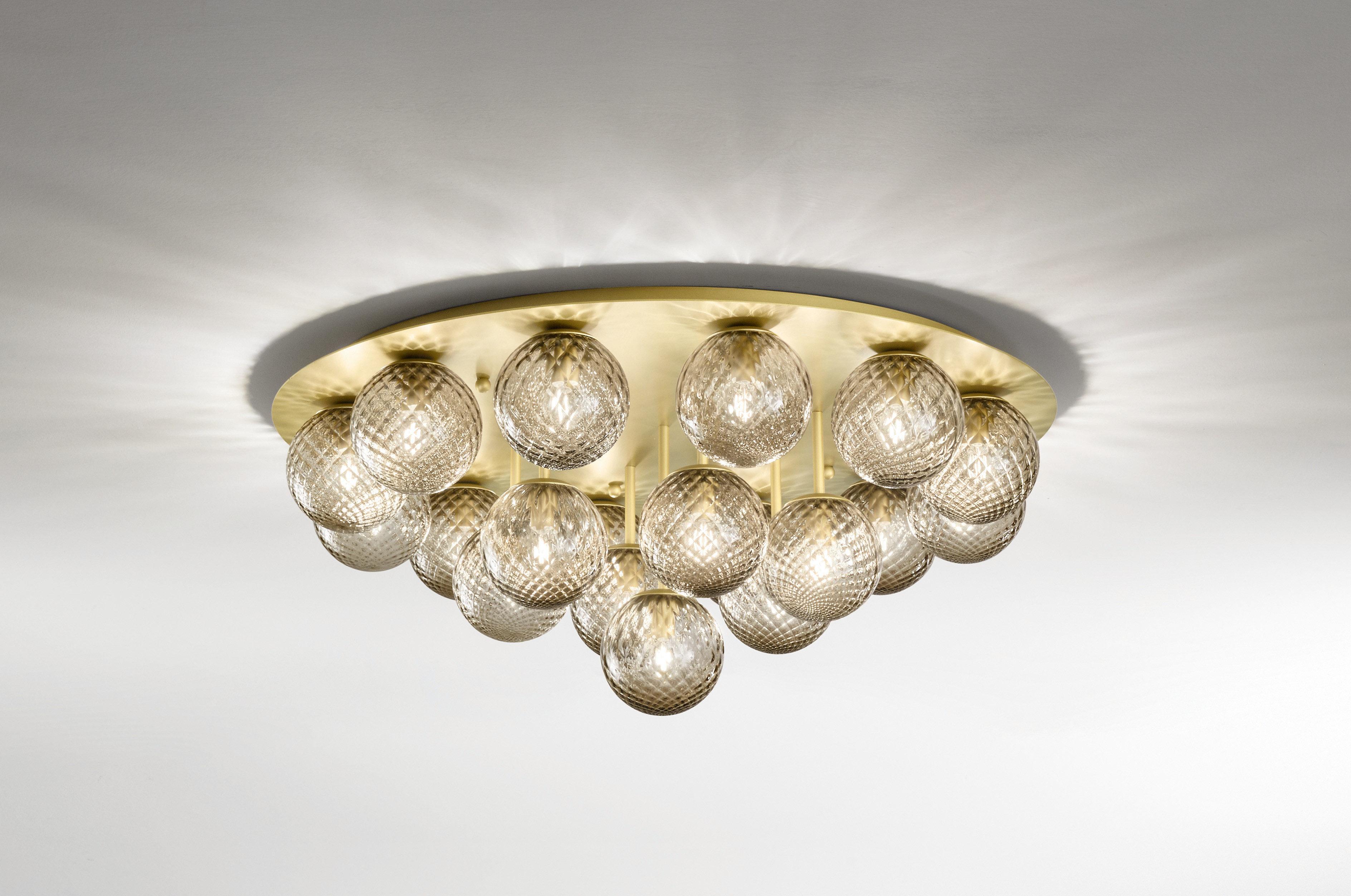 Italian modern flush mount with clear or smoky textured Murano glass globes, mounted on round ceiling plate in satin gold metal finish / Made in Italy by Fabio Ltd
19 lights / E12 or E14 type / max 40W each
Measures: diameter 37 inches, height 16