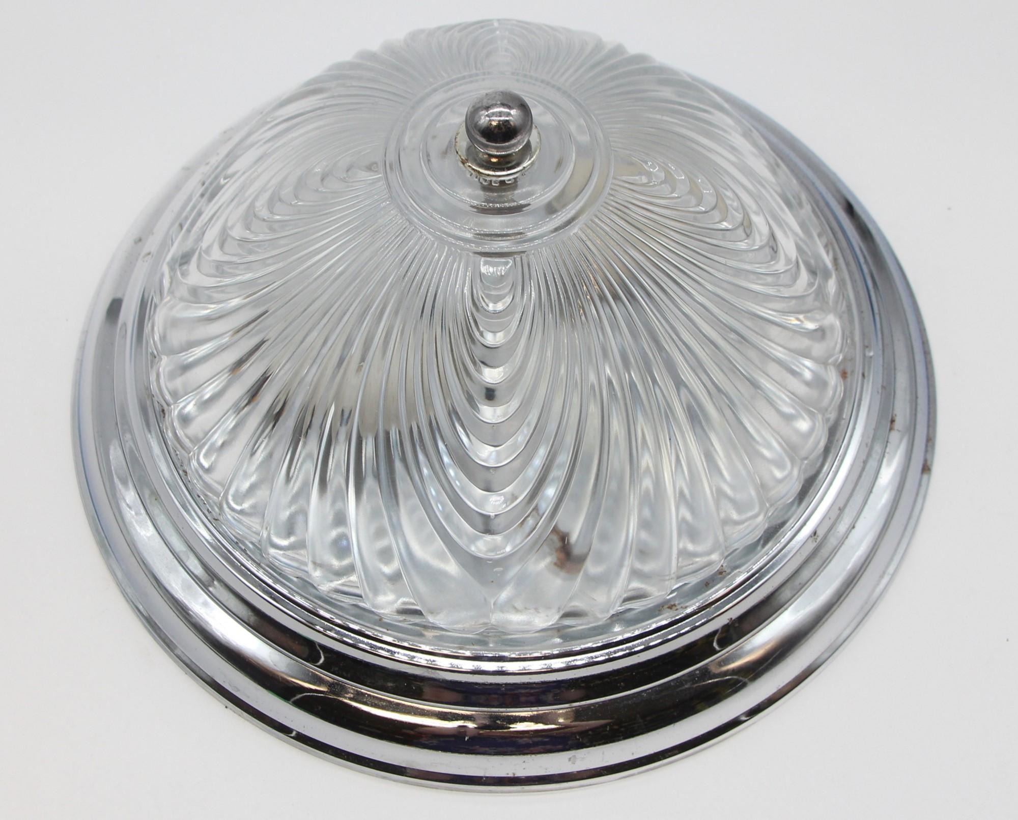 Late 20th century flush mount fixture featuring Austrian cut crystal fixture and a chrome plated rim. This will be cleaned and rewired before shipping. Small quantity available at time of posting. Priced each. Please inquire. Please note, this item