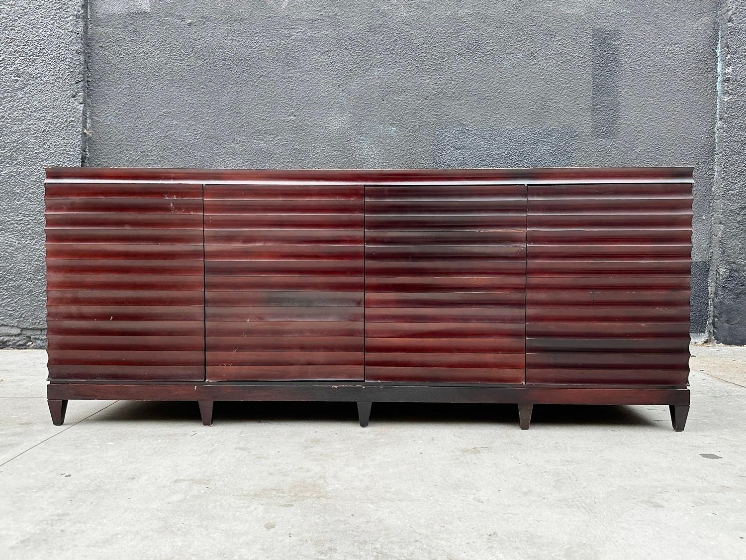 Introducing the exquisite Modern Fluted Buffet Sideboard Cabinet by Barbara Barry, crafted exclusively for Baker Furniture in 2010. This impeccable creation showcases the timeless elegance that defines the brand. Meticulously constructed from solid