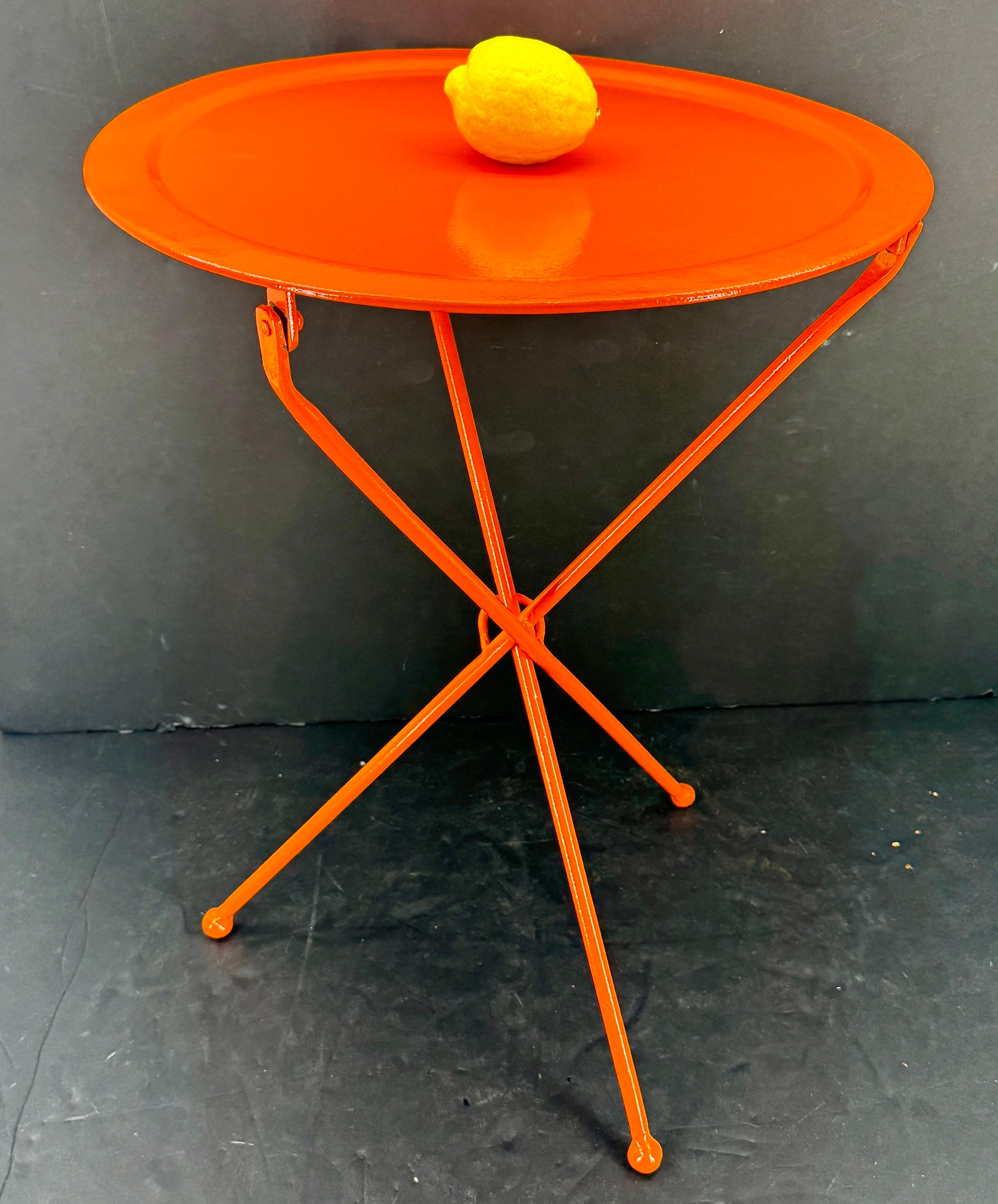 Fantastic cafe collapsable table powder-coated in a color we like to call Hermes Orange. This sturdy and versatile table can be used formally or informally in a kitchen area, living room or even next to a bed for that room seeking 