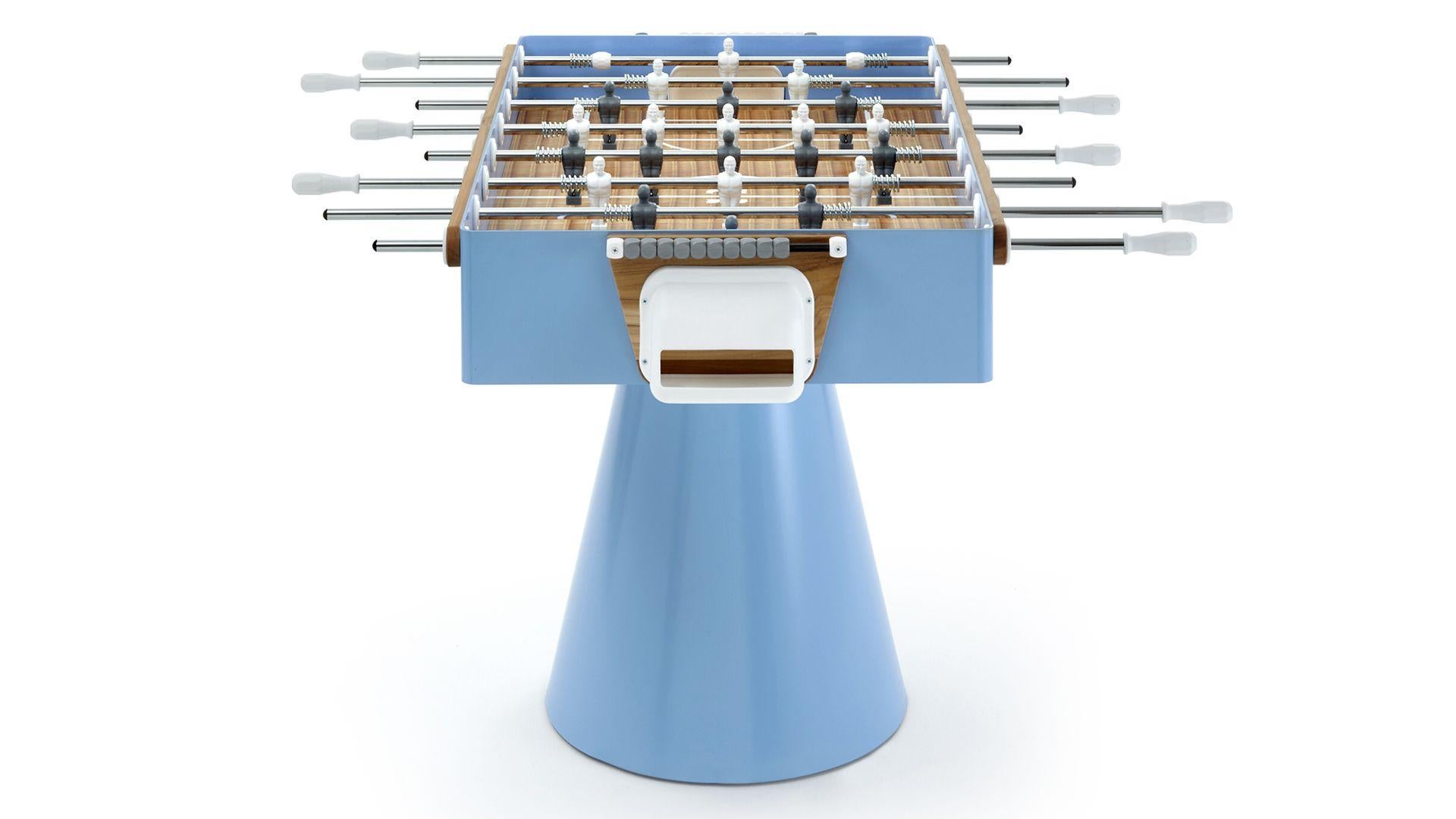 Professional football table called Capri, a special edition inspired by the ‘50 Italian car “spiaggina” (popular in Capri) with a light blue structure, light wooden inserts and a wicker texture printed on the game table. A tribute to Naples and its