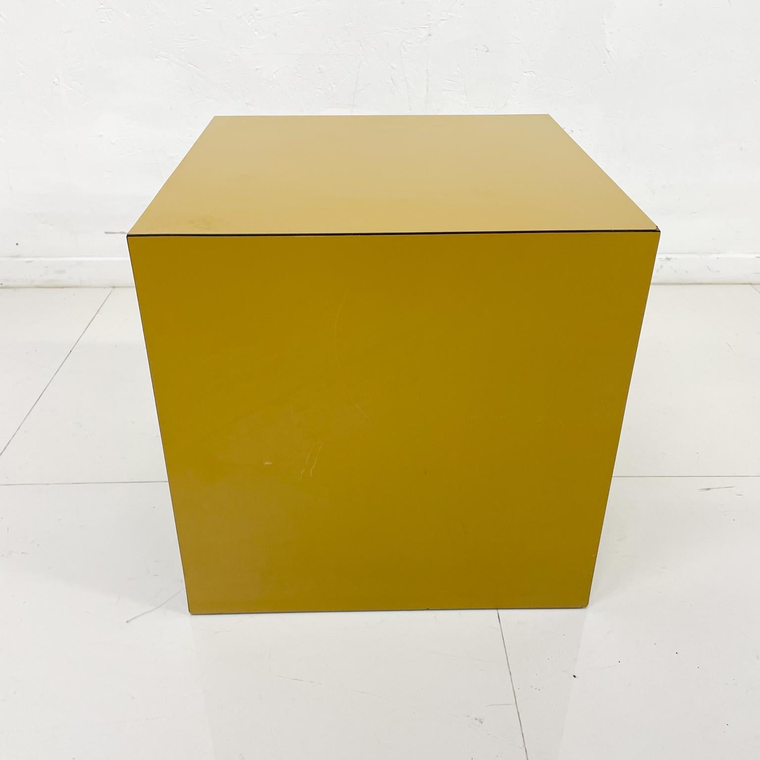 Cube table
1970s Mid-Century Modern made in the USA. Side end table covered in Formica- Perfect Cube. Mustard color.
No label. Inscription on inside with black marker.
Size 15.63 cube
Overall good preowned unrestored condition. One corner has