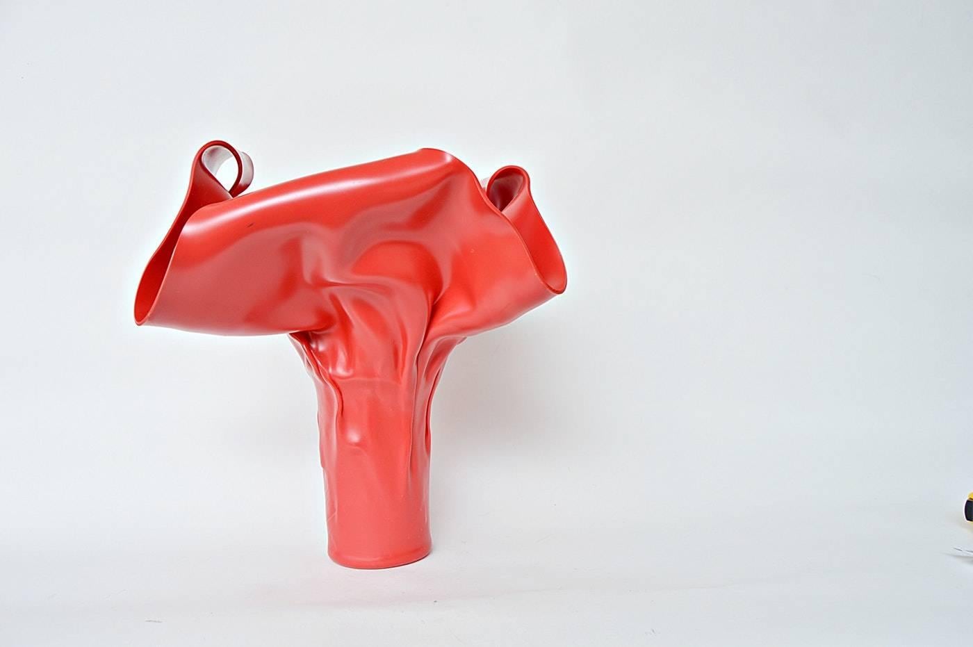 Modernist hand formed red plastic sculpture. Signed illegibly and dated 1990.