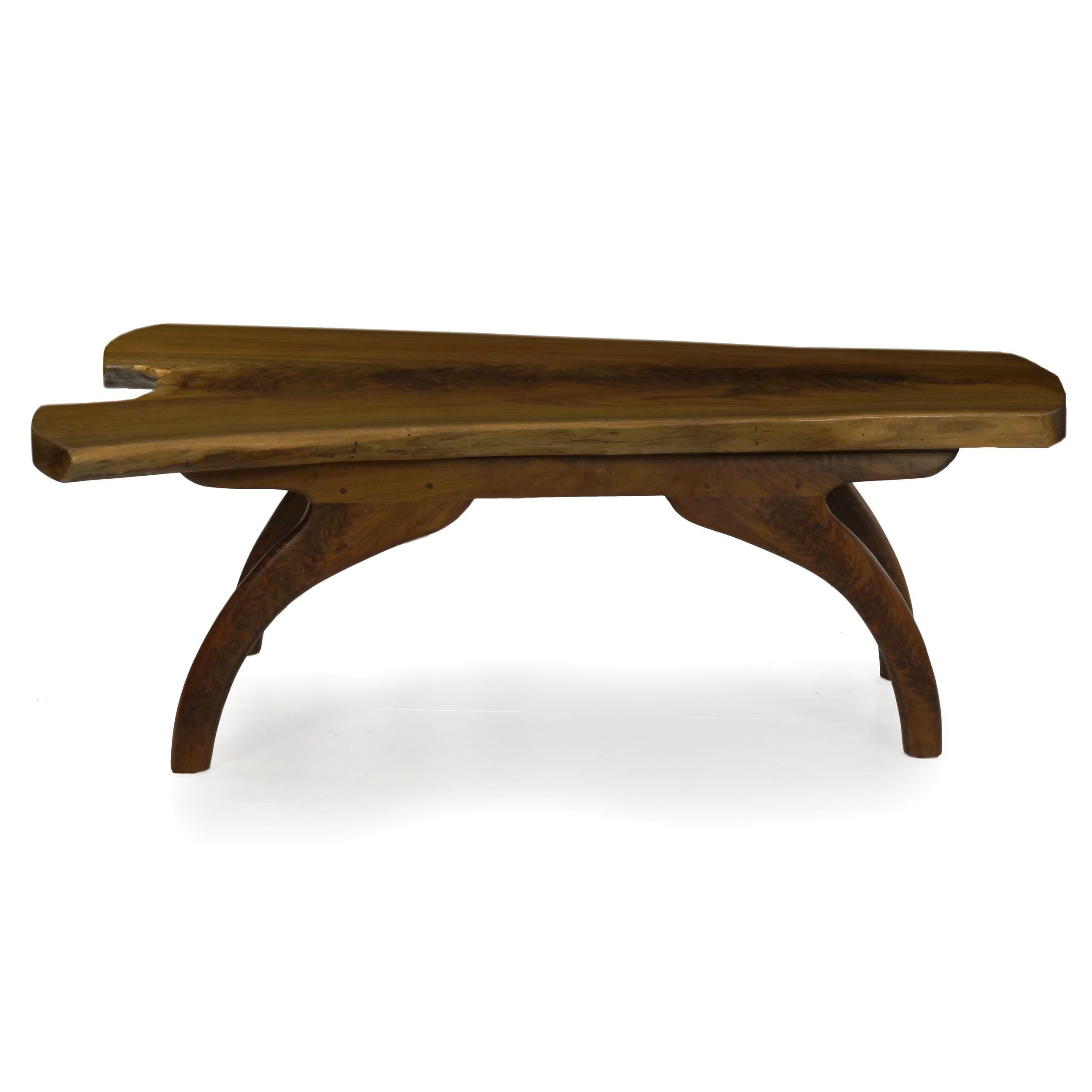 MODERN FREE-FORM LIVE EDGE WALNUT COFFEE TABLE
By Philip Andrews, ca. 2000s; branded to underside
Item # 604ILH15P 

An unusual and powerful design by craftsman Philip Andrews, it features a stunning thick solid plank of walnut captured where the