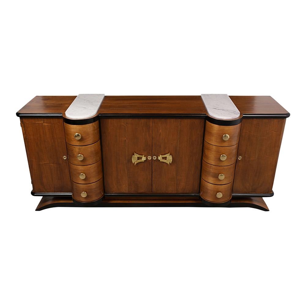 This 1930s French Art Deco-style walnut buffet has been fully restored and is stained in a walnut & black color combination with a newly lacquered finish. The credenza features two rounded white marble inserts in the top, two side doors, eight
