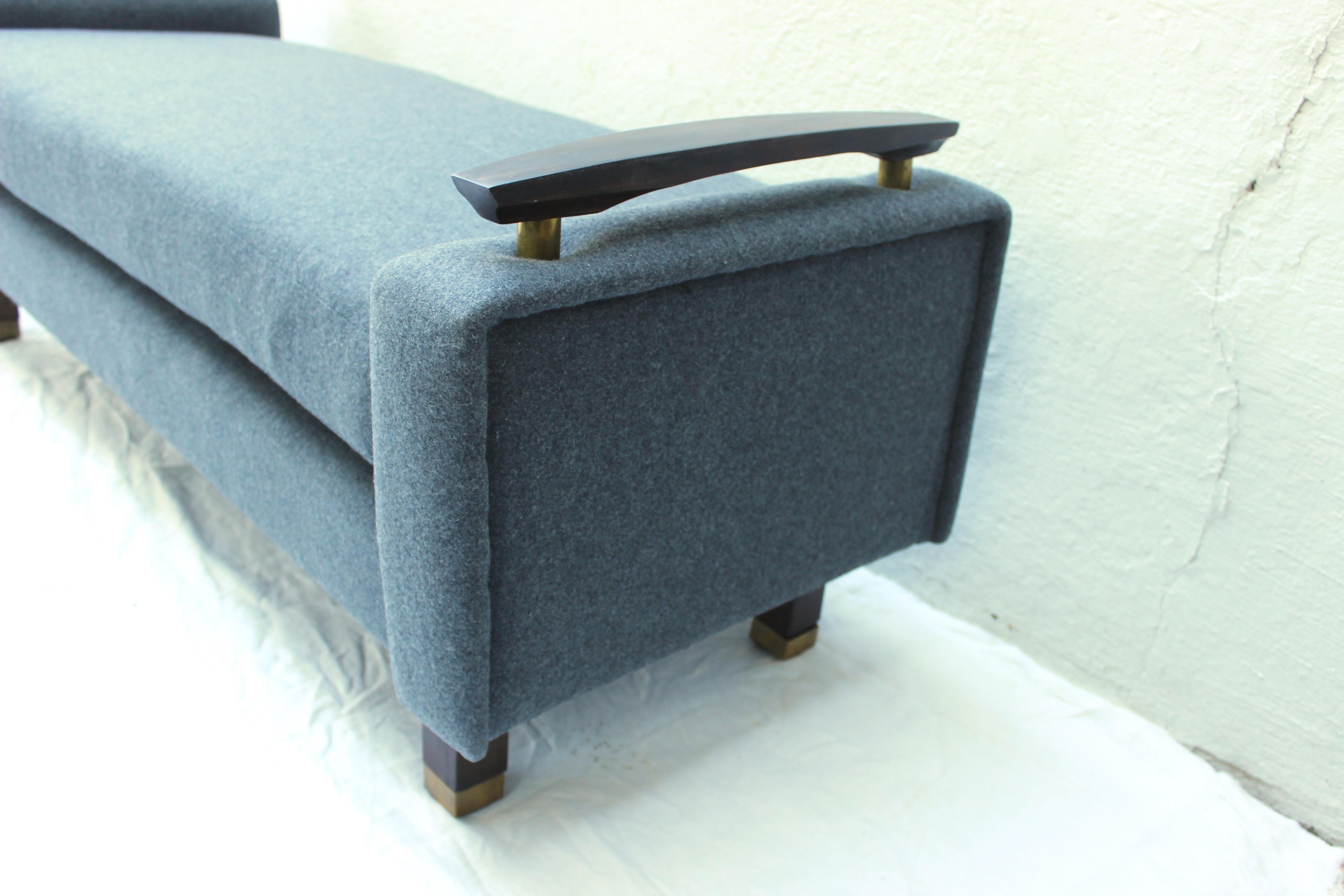 Modern French deco floating arm bench with walnut and brass details.
Newly upholstered in Grey Cashmere/wool.