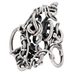 Bague de designer français moderne en argent entrelacée