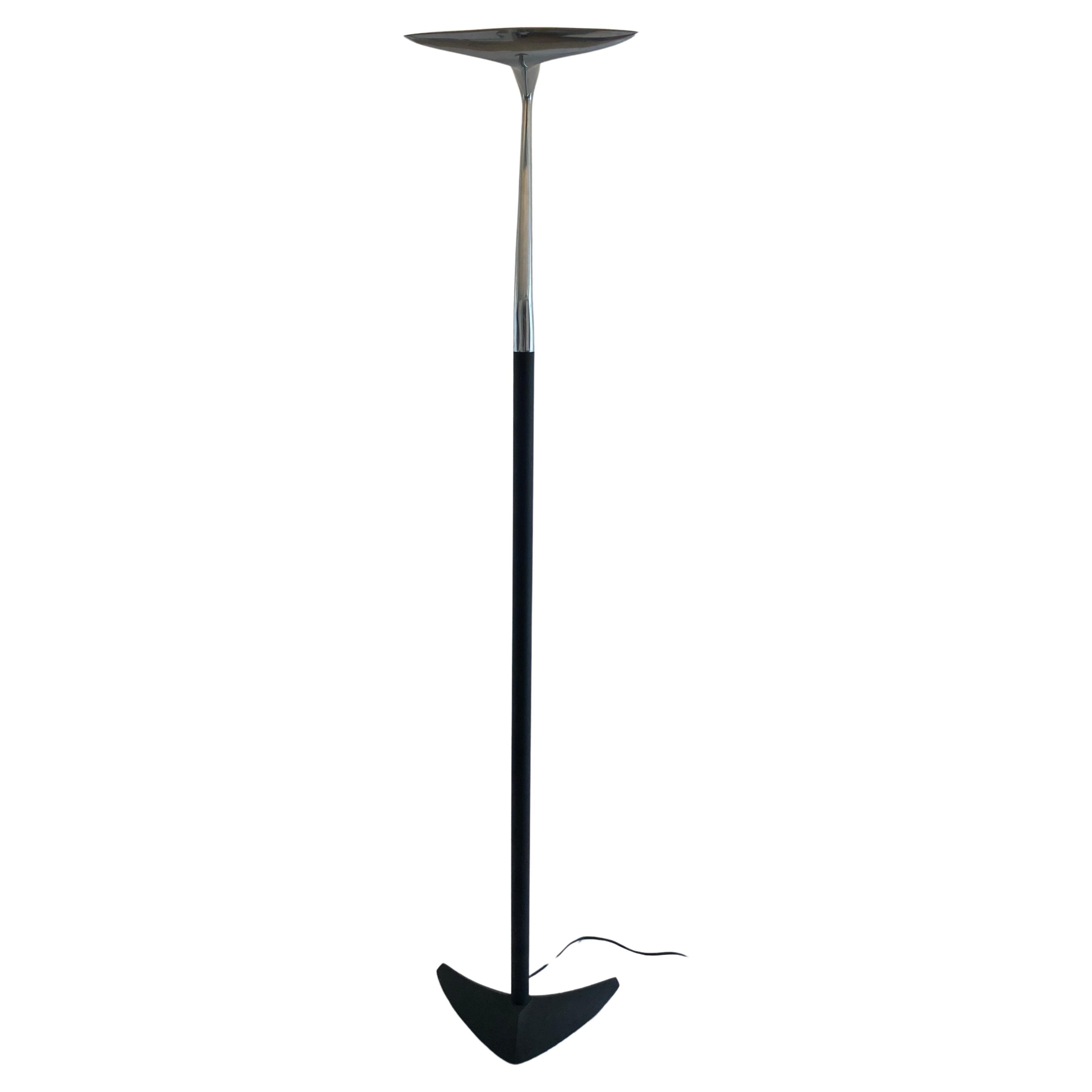 Elevate your living space with the sculptural elegance of this modern floor lamp by LG, Paris.  This French made masterpiece features a sleek, polished chrome design that instantly enhances any room.

The stylish design provides the perfect indirect