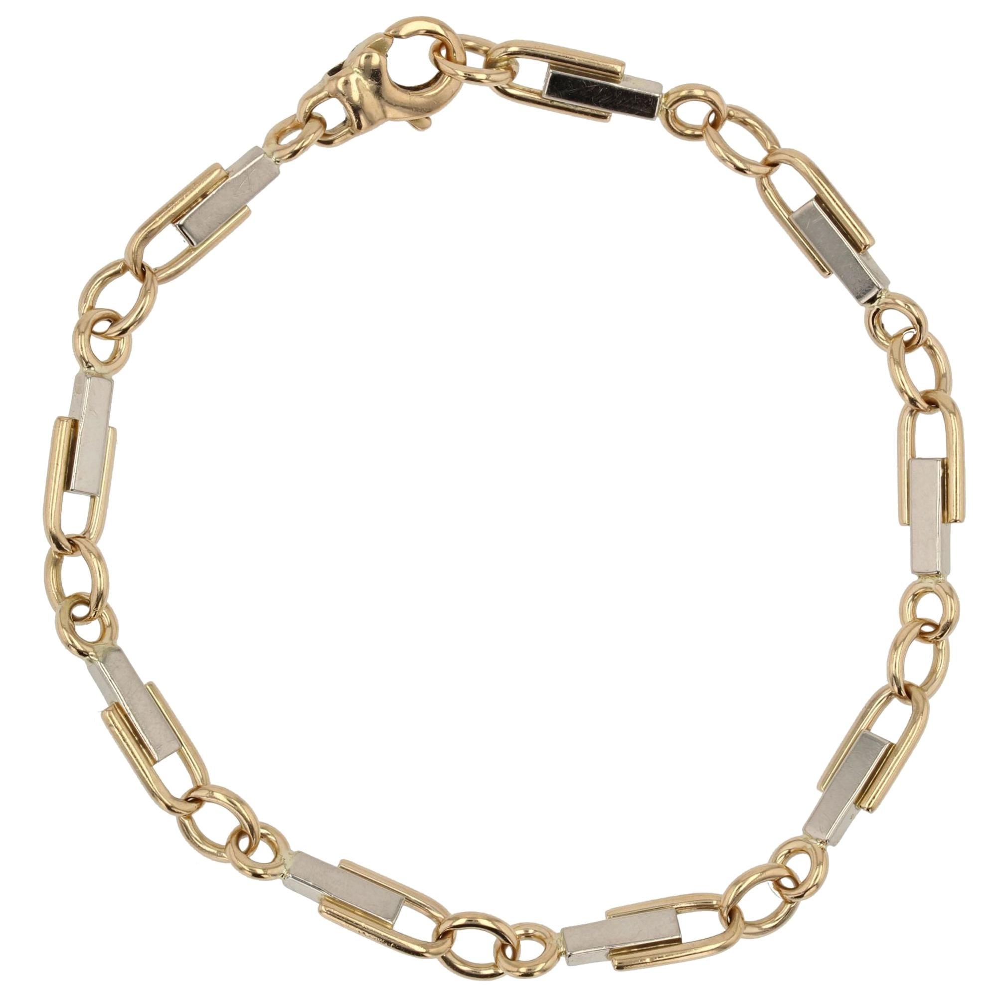 Bracelet français moderne en maille étrier en or jaune et blanc 18 carats