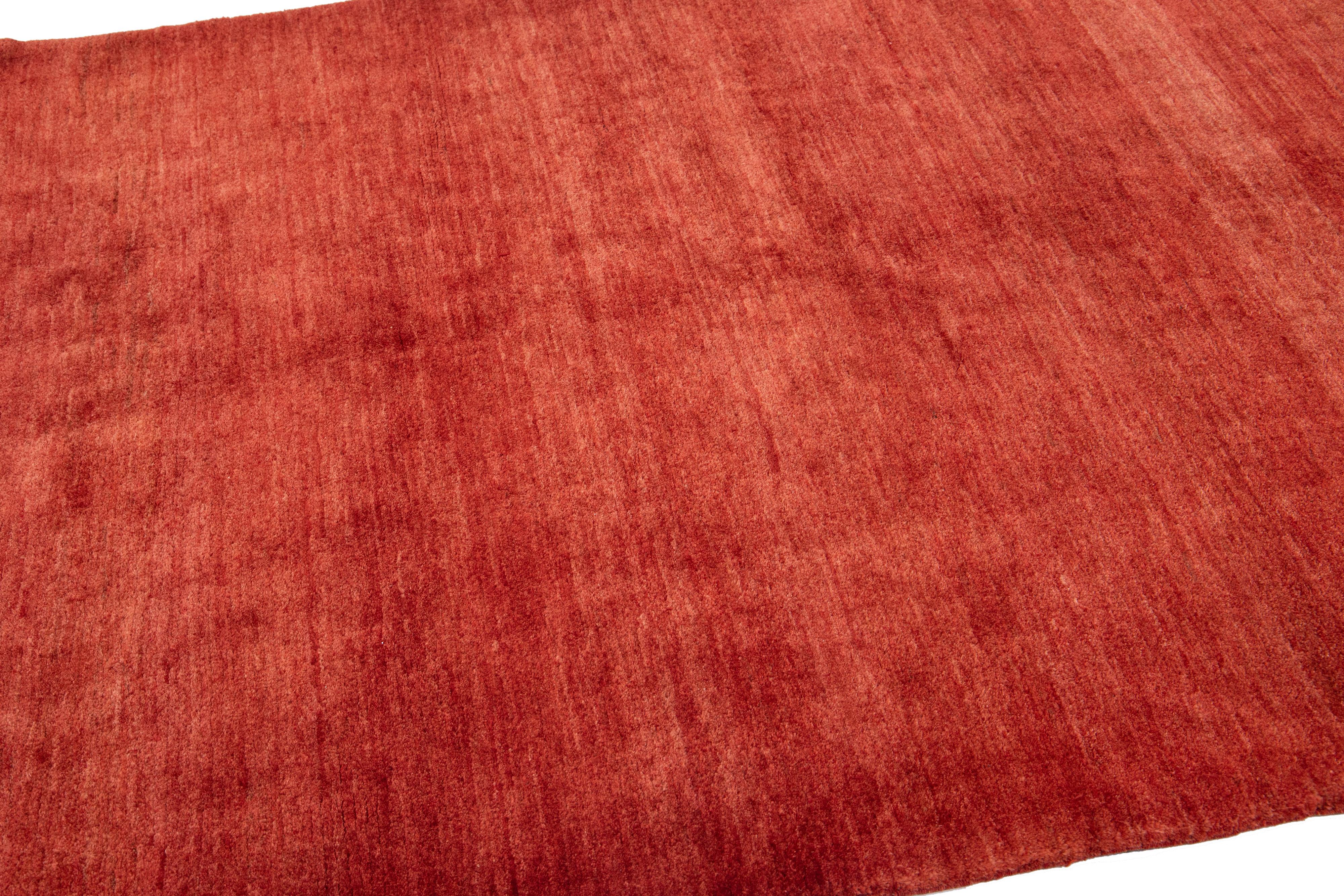 Hand-Knotted  Modern Gabbeh Style Handmade Wool Rug with Solid Red-Rust Motif For Sale
