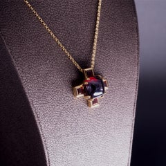 Modern Garnet and Gold Cross Pendant Necklace