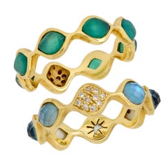Moderna alianza de oro amarillo de 18k con piedras preciosas y diamantes