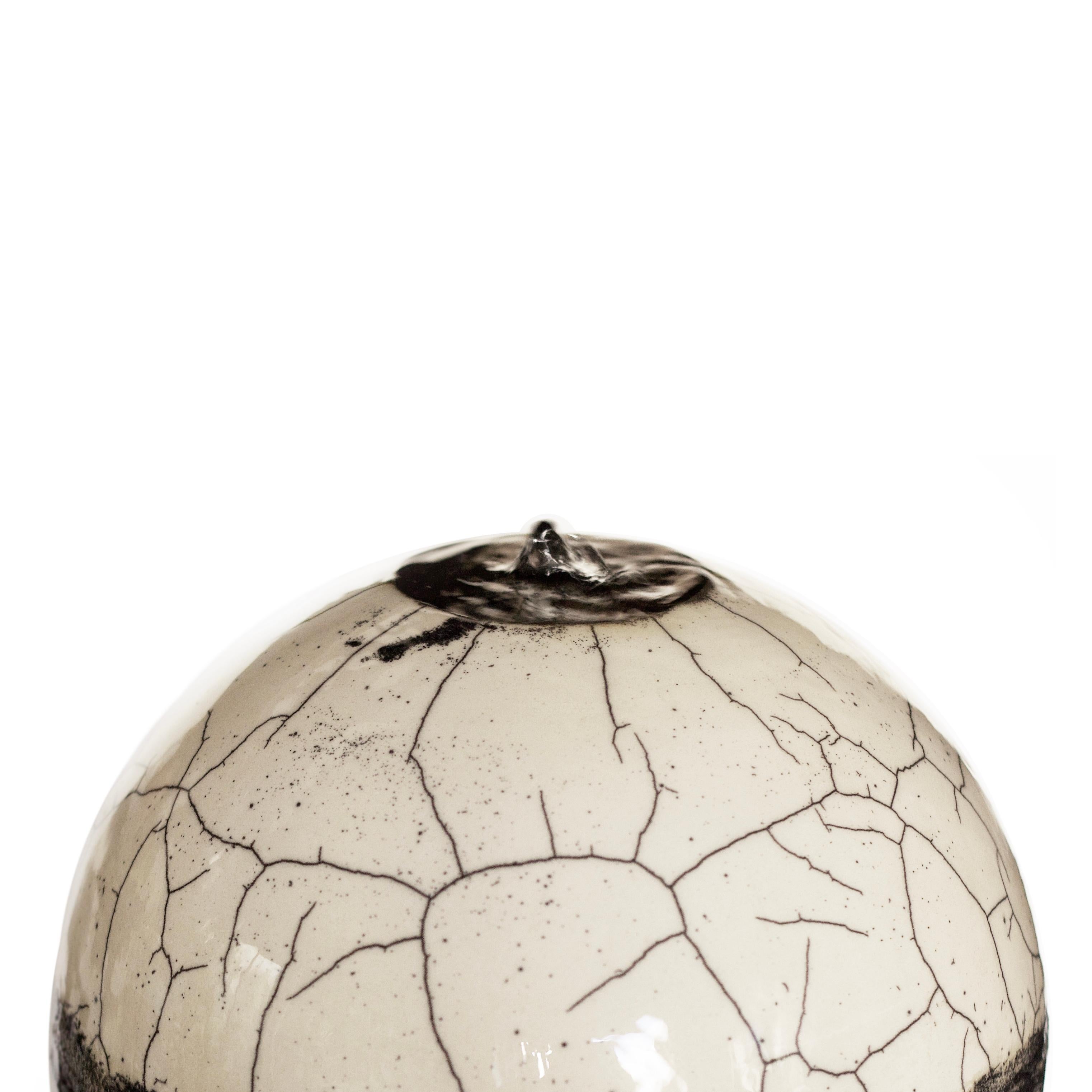 The mightiest of the Genesi fountains. Its large Raku components are already a masterpiece by themselves, combined in the form of this perpetual murmuring fountain become something mesmerizing and impactful in their circular design. The sphere
