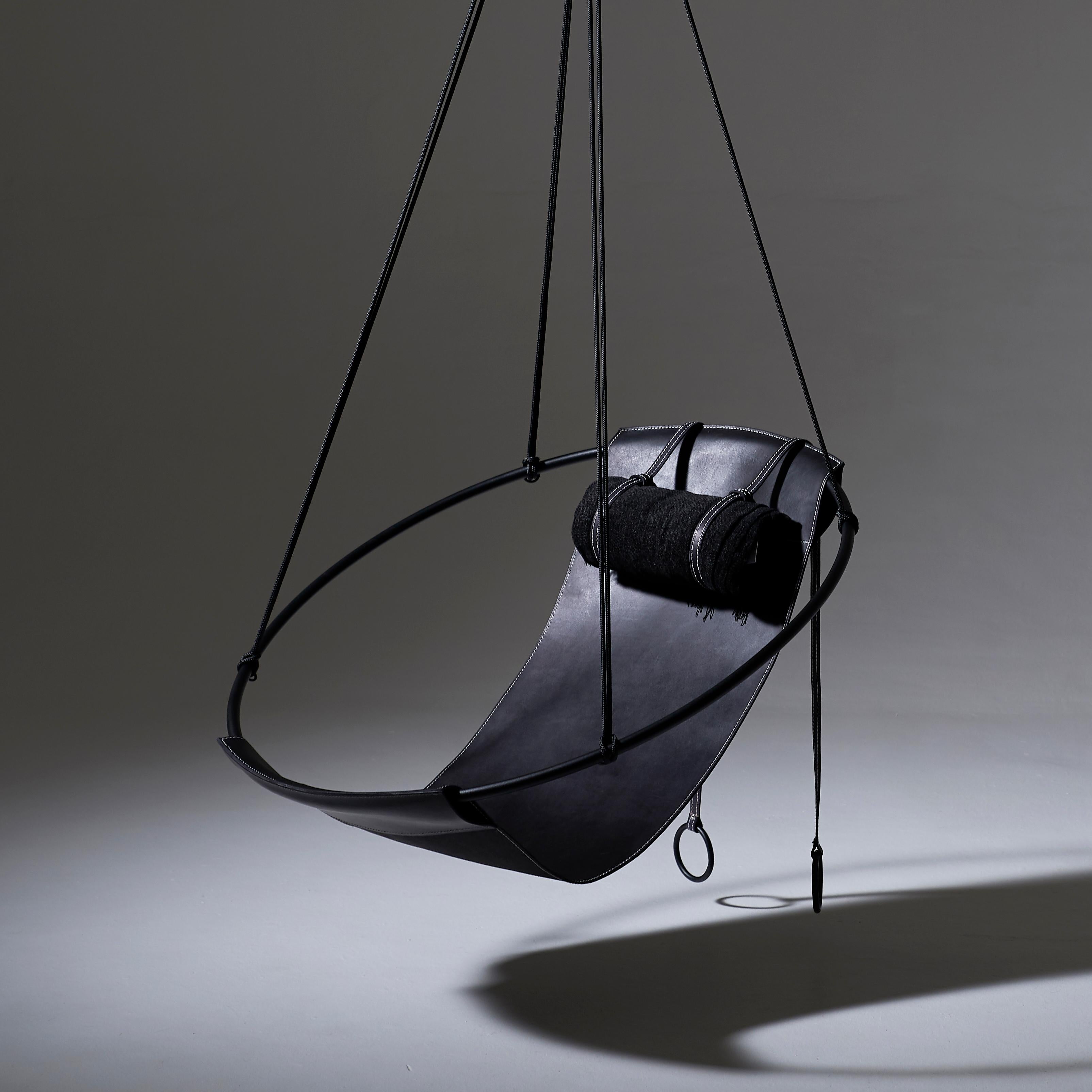 Stripped away from all excess, this hanging chair has a circular frame with a sheet of natural thick leather hanging loose within it, to create a sleek, sexy, and oh so comfortable experience. This chair’s clean lines and lightness makes it a