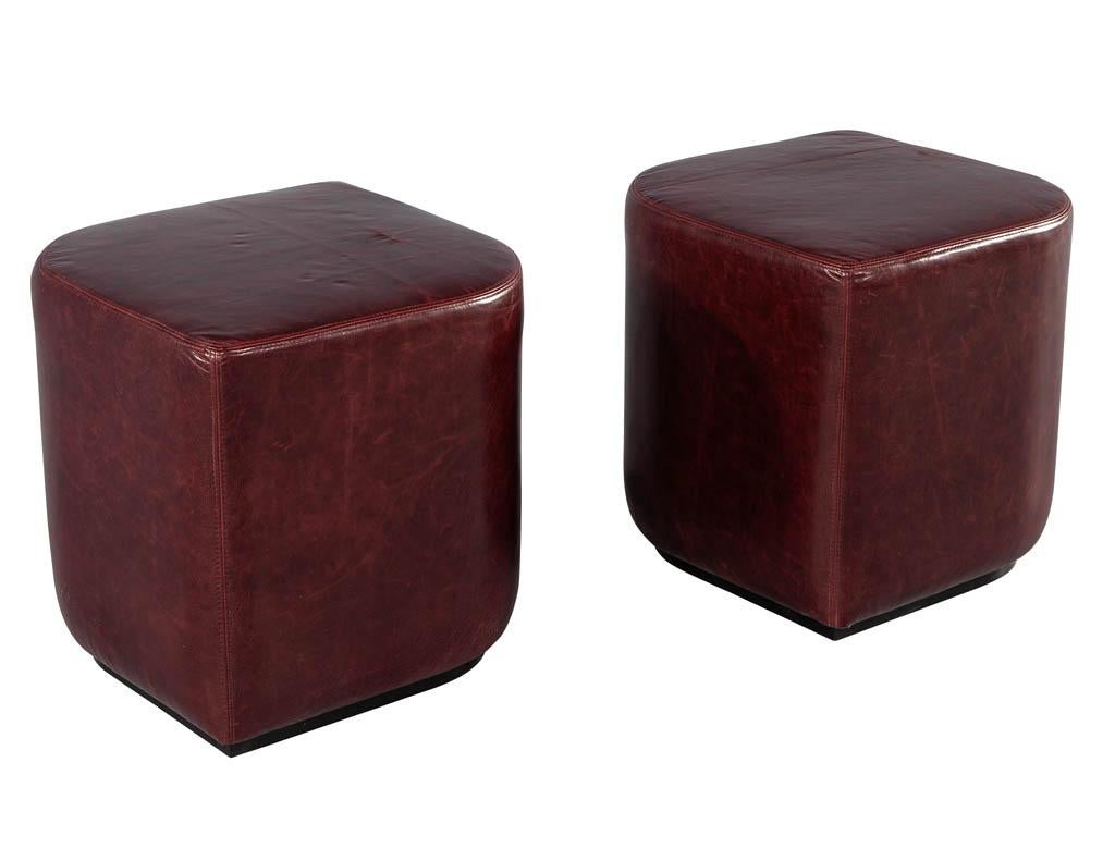 Modern Geometric Ottomans in Distressed Burgundy Leather . Unique geometric shaping makes this modern ottoman stand out. Fully upholstered in a distressed leather with a dark burgundy color tone with a hint of plum. Leather naturally distresses