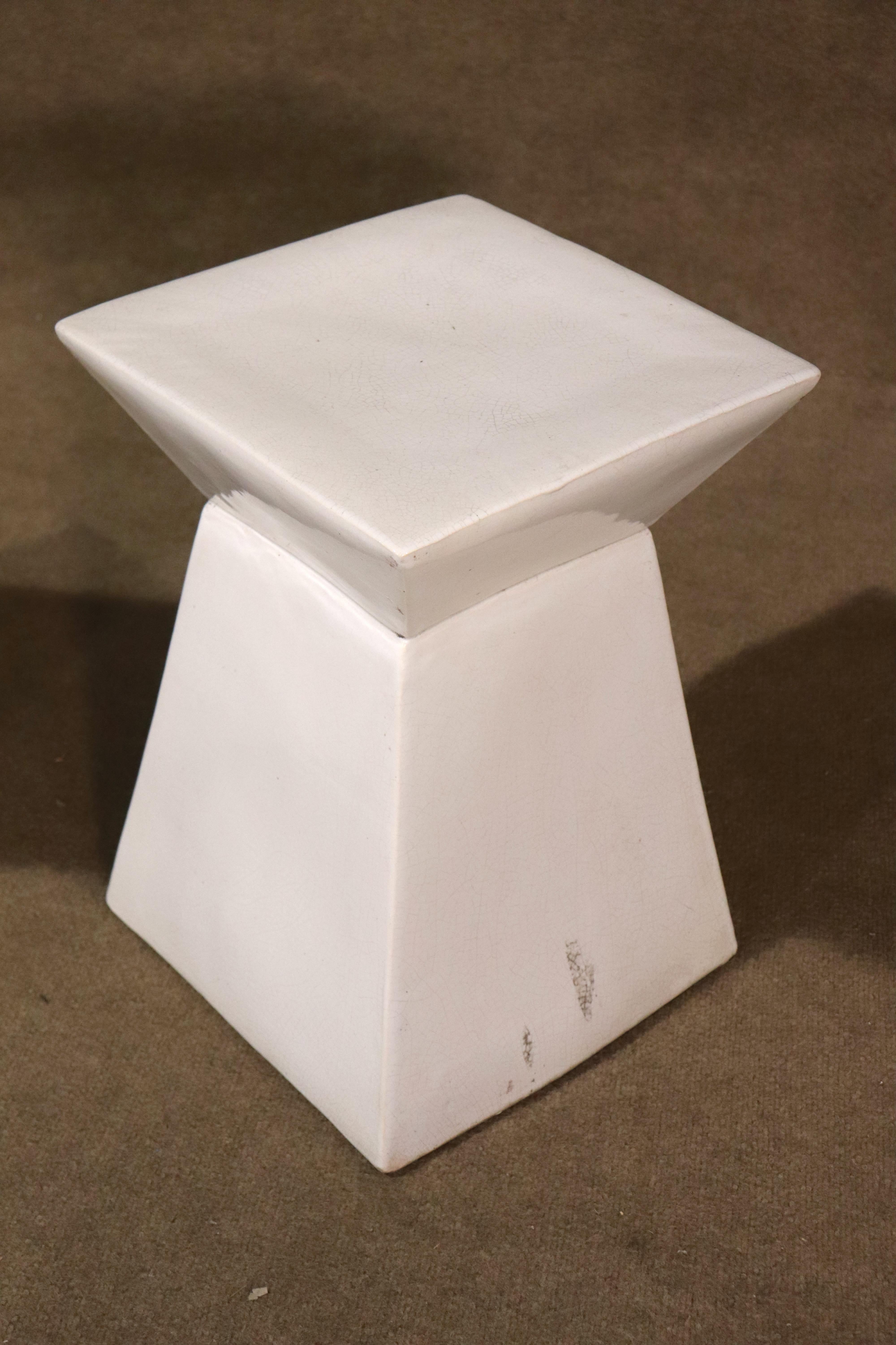 Pair of white ceramic pottery pedestals with a modern geometric shape. Great for holding plants, or as living room side tables.
Please confirm location NY or NJ