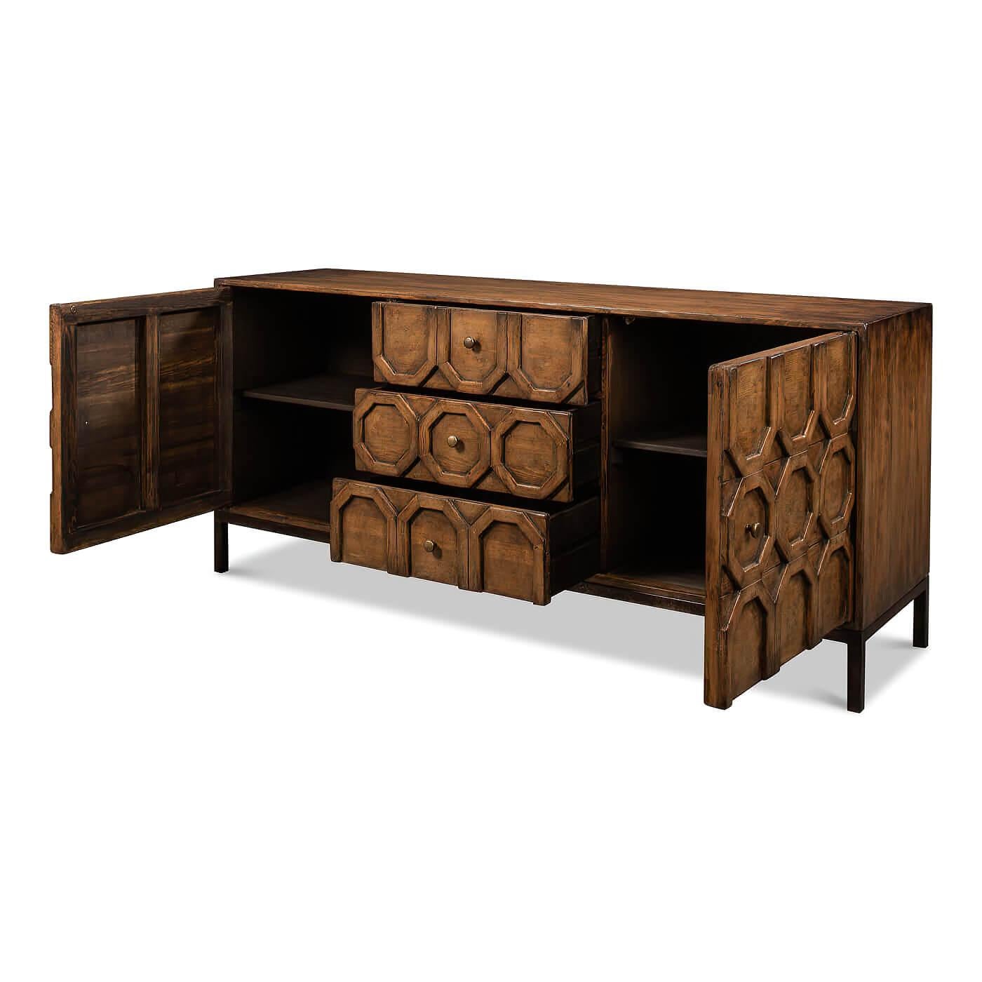 A modern geometric sideboard. This front has a unique applique design with patterns of octagons running down the center. It has two doors and a bank of three drawers in the center. The sideboard rests on a metal base. 

This beautiful piece is