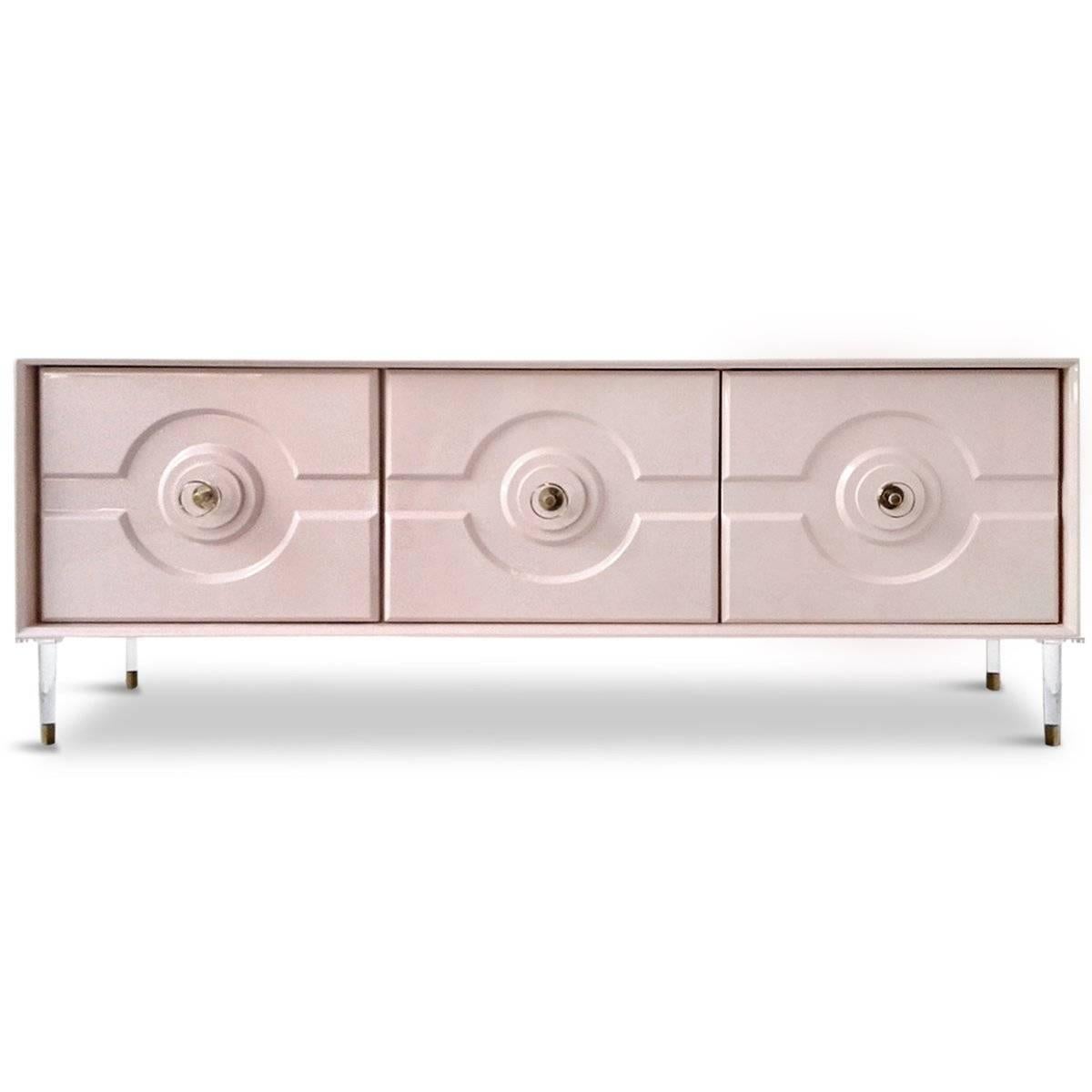 Introducing the Sorrento 3 Door Credenza. Featuring a bold geometric design, tapered lucite legs, and round lucite pulls, this striking piece is the perfect way to hide away clutter and add style to any room. 

Dimensions:
72
