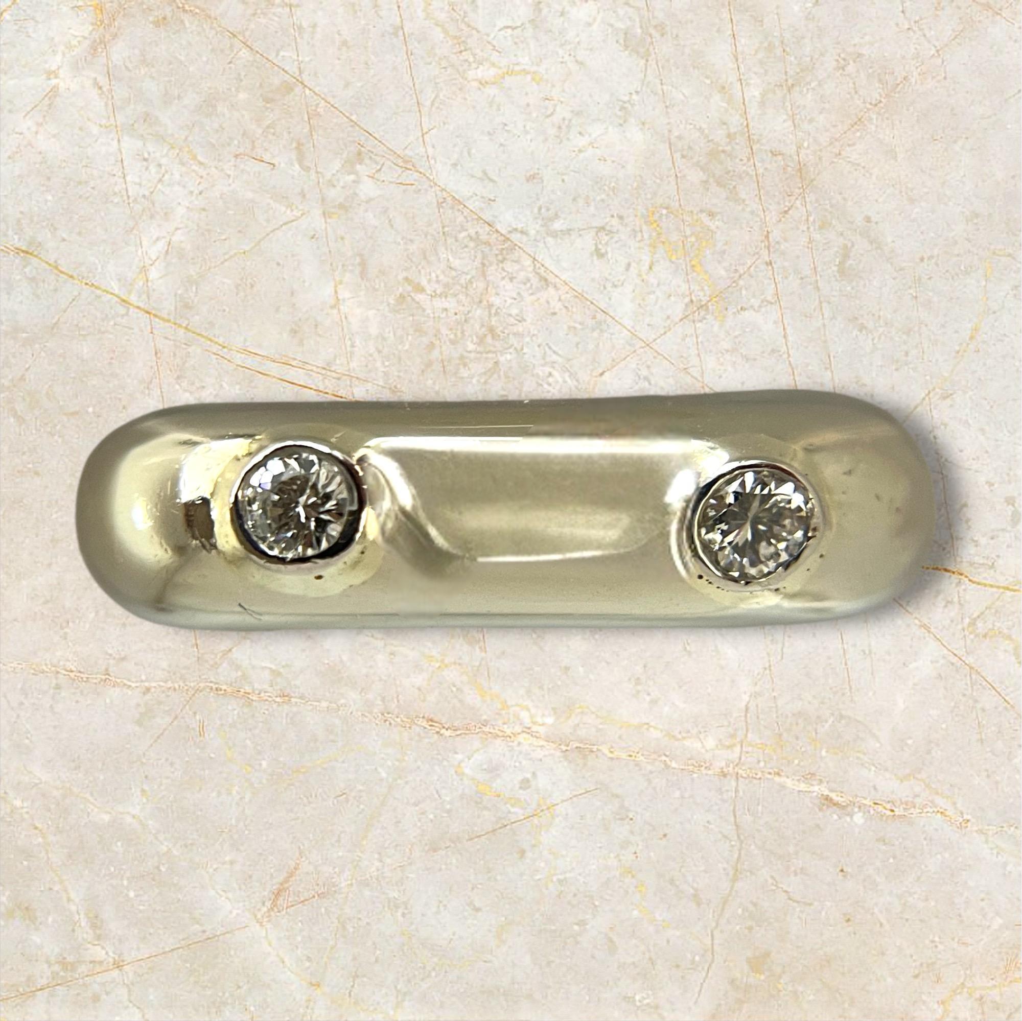 Embrace modern sophistication with this eye-catching geometric white gold stack ring. Its distinct square band boasts a smooth, polished finish that captures the light for a sleek, contemporary look. Featuring two delicate diamonds elegantly nestled