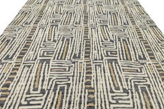 Moderner geometrischer Wollteppich - Abstraktes Labyrinth-Muster in Anthrazit und Creme
