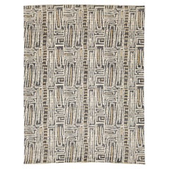 Moderner geometrischer Wollteppich - Abstraktes Labyrinth-Muster in Anthrazit und Creme