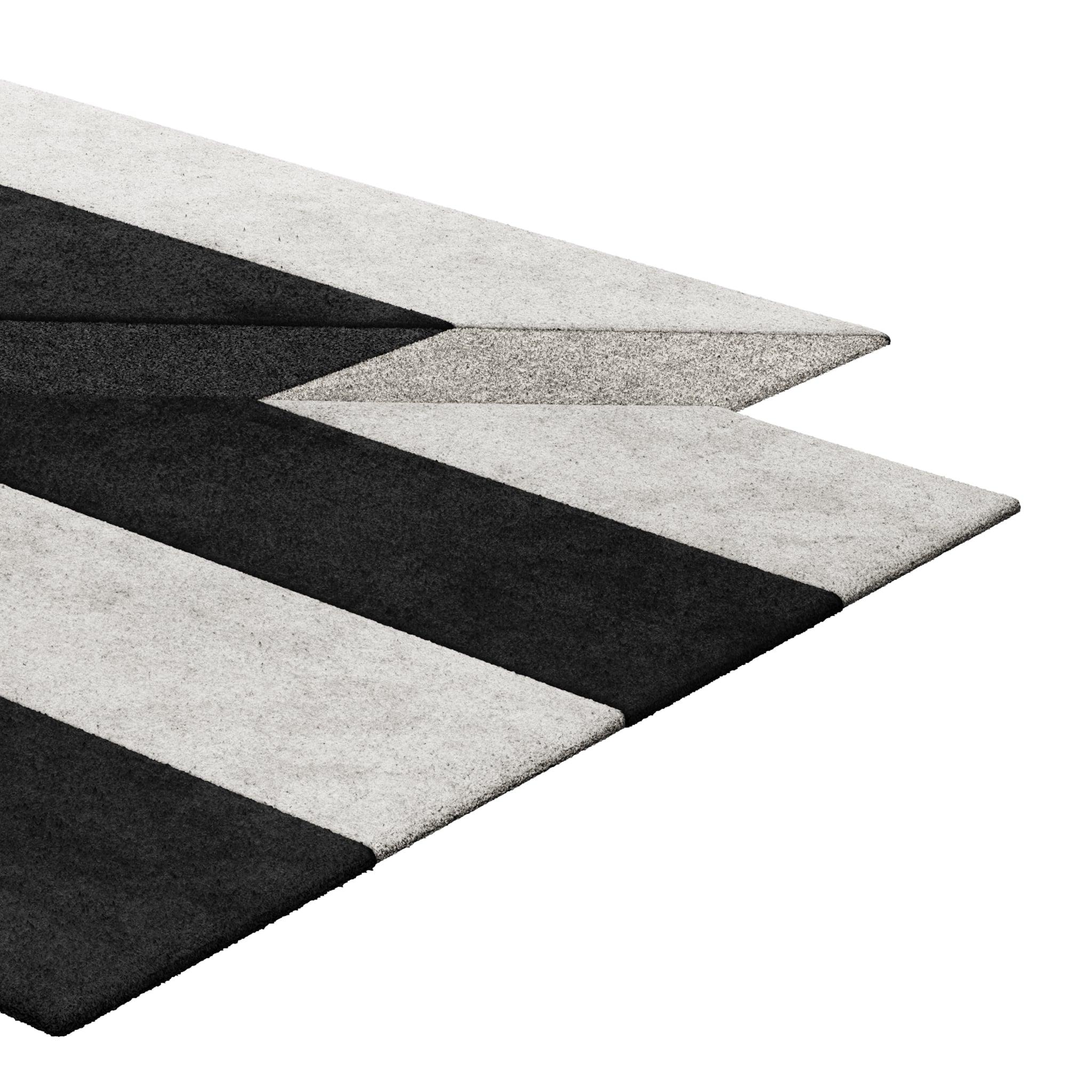Tapis Retro #010 is a retro rug with an irregular shape and monochromatic hues. Inspired by architectural lines, this geometric rug makes a statement in any living space.

Using a 3D-tufted technique that combines cut and loop pile, the retro rug