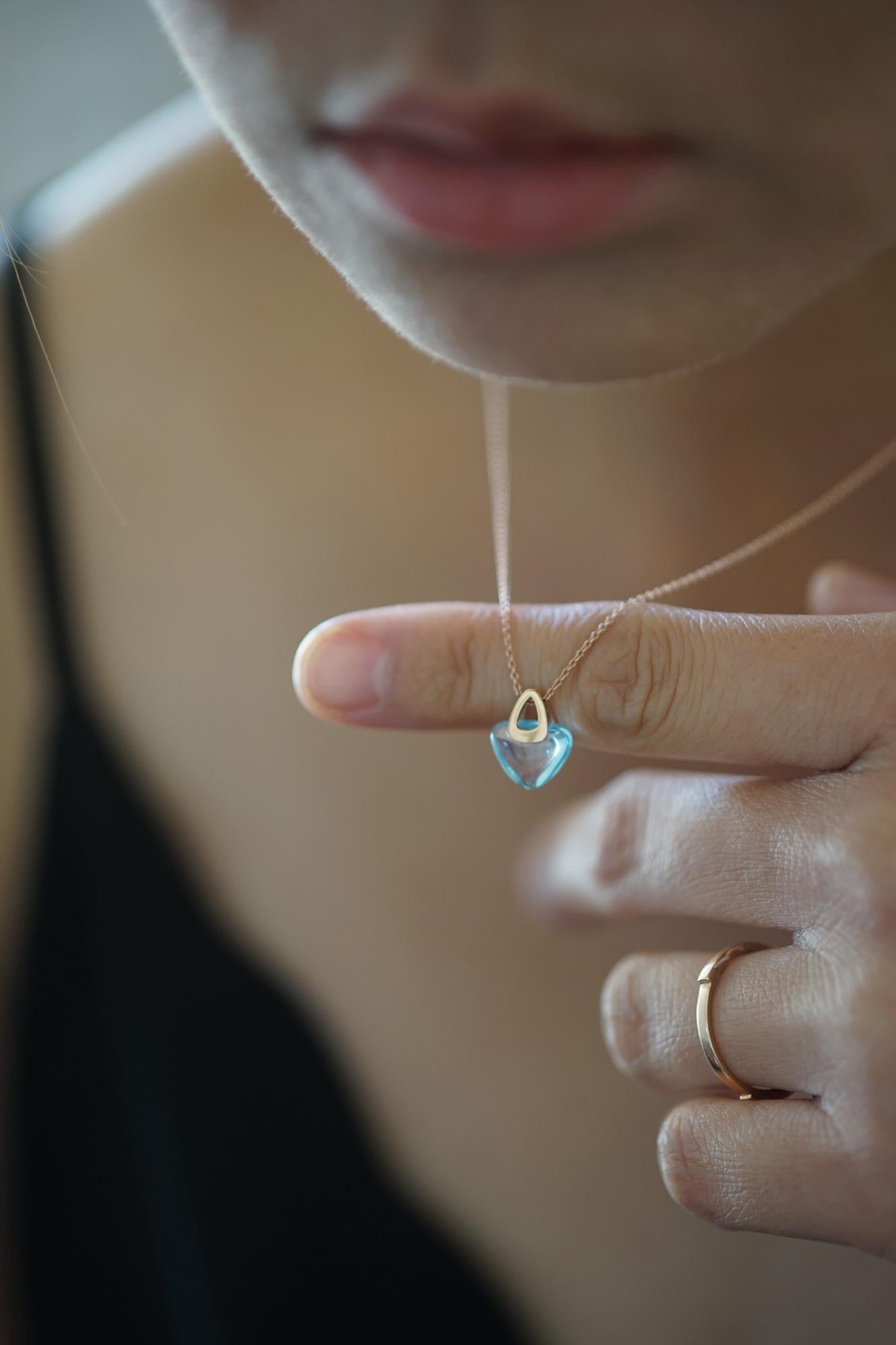 Rebecca Li designs mindfulness. 
This design is from her Luck Rock Collection.

Talisman Pendant :
18K Rose Gold
Natural Blue Topaz
Pendant Size: 9 mm W * 6 mm D * 18 mm H
Gemstone Size:  8 mm W * 6 mm D * 9 mm H

Chain: 
18K Rose Gold
Adjustable
