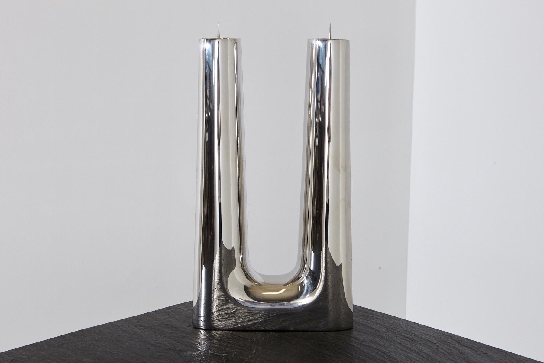 A modern, simple, Minimalist polished stainless steel candleholder by Georg Jensen for two candles.
The candleholder has some minor scratches to the surface consistent to use.
  