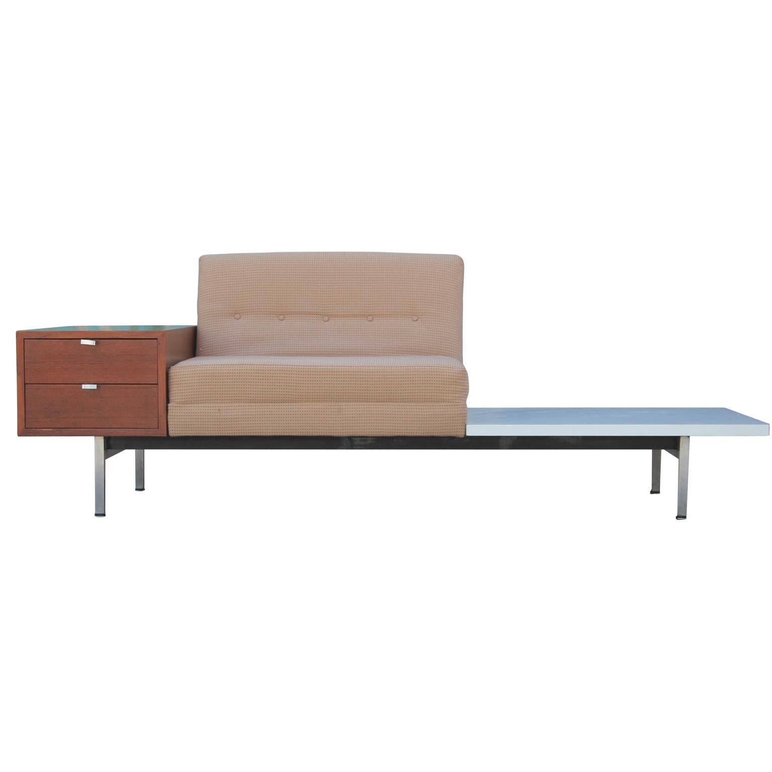 Lovely sofa by George Nelson for Herman Miller as part of their Modular Group line featuring an attached white side table and two walnut drawers. Fun and functional addition to any space.