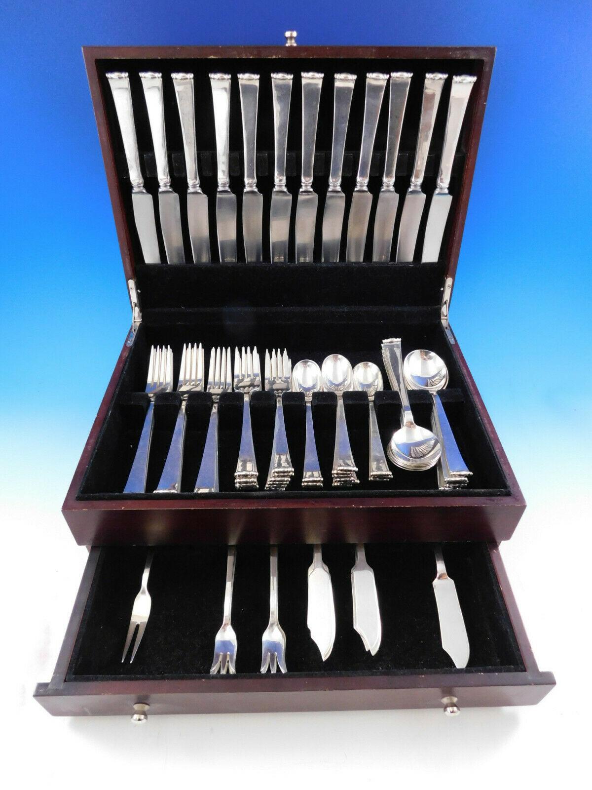 Modern Georgian by Allan Adler hand wrought sterling silver flatware set, 86 pieces. This set includes:

12 dinner knives, solid handles, 9 5/8